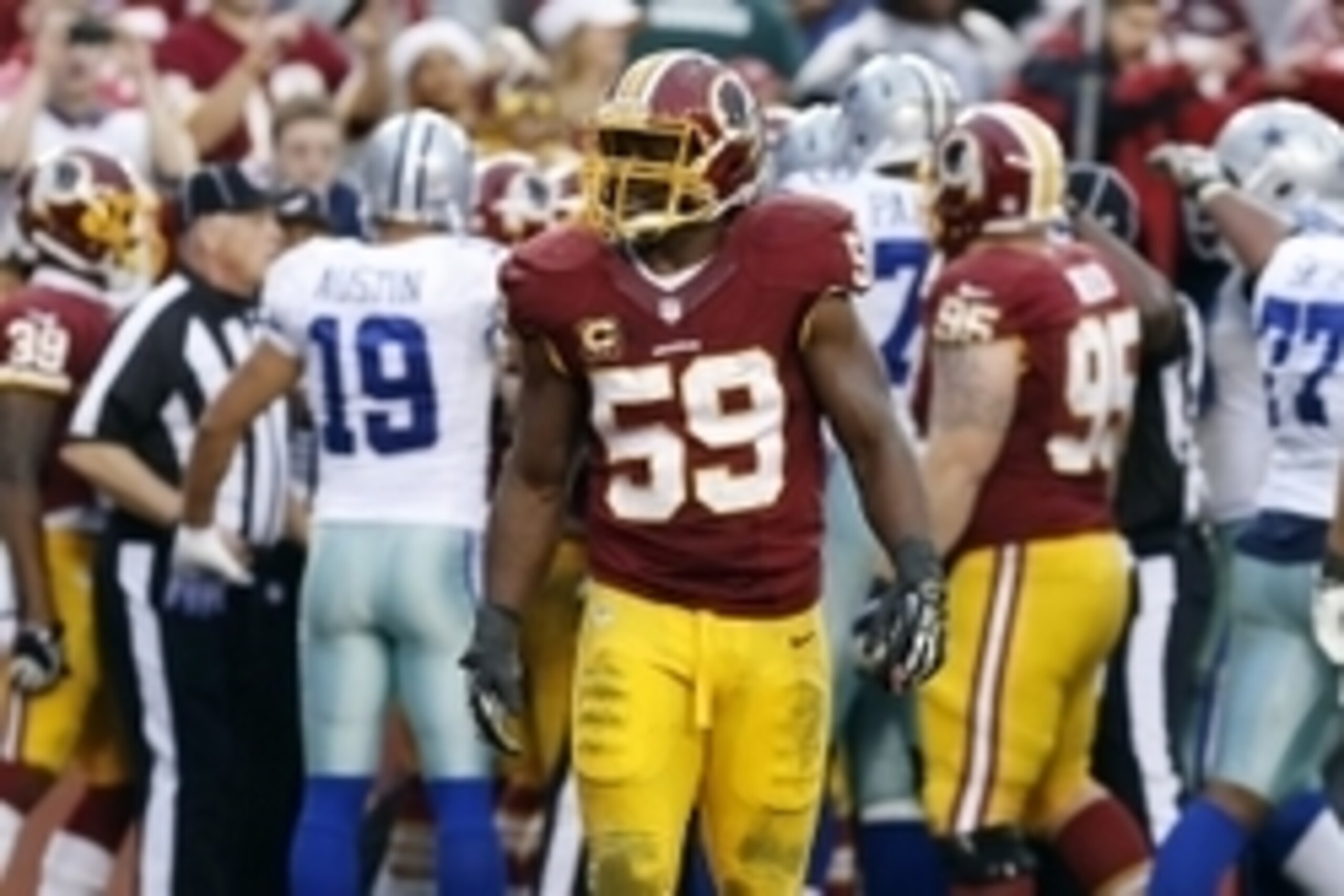 Dec 22, 2013; Landover, MD, USA; Washington Redskins inside linebacker London Fletcher (59) stands on the field after the Dallas Cowboys scored the game winning touchdown in the final minute of the fourth quarter at FedEx Field. The Cowboys won 24-23. Man