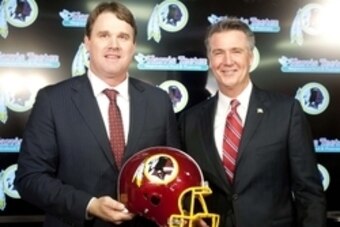 Jan 9, 2014; Ashburn, VA, USA; Washington Redskins head coach Jay Gruden and general manager Bruce Allen pose for a photo after a press conferences at Redskins Park Team Auditorium. Mandatory Credit: Brad Mills-USA TODAY Sports