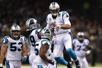 NEW ORLEANS, LA - DECEMBER 07:  Cam Newton #1 of the Carolina Panthers celebrates after throwing a touchdown pass early in the second quarter against the New Orleans Saints  at Mercedes-Benz Superdome on December 7, 2014 in New Orleans, Louisiana.  (Photo
