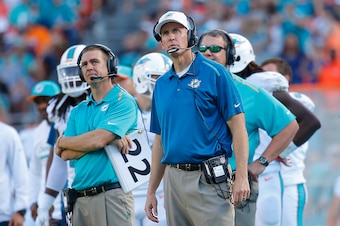 MIAMI GARDENS, FL - DECEMBER 07: Head coach Joe Philbin (C) of the Miami Dolphins looks on in the fourth quarter of play against the Baltimore Ravens during a game at Sun Life Stadium on December 7, 2014 in Miami Gardens, Florida. The Ravens won the game