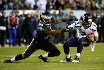 PHILADELPHIA, PA - DECEMBER 07:  Trent Cole #58 of the Philadelphia Eagles attempts to tackle quarterback  Russell Wilson #3 of the Seattle Seahawks at Lincoln Financial Field on December 7, 2014 in Philadelphia, Pennsylvania. The Seahawks won 24-14.  (Ph