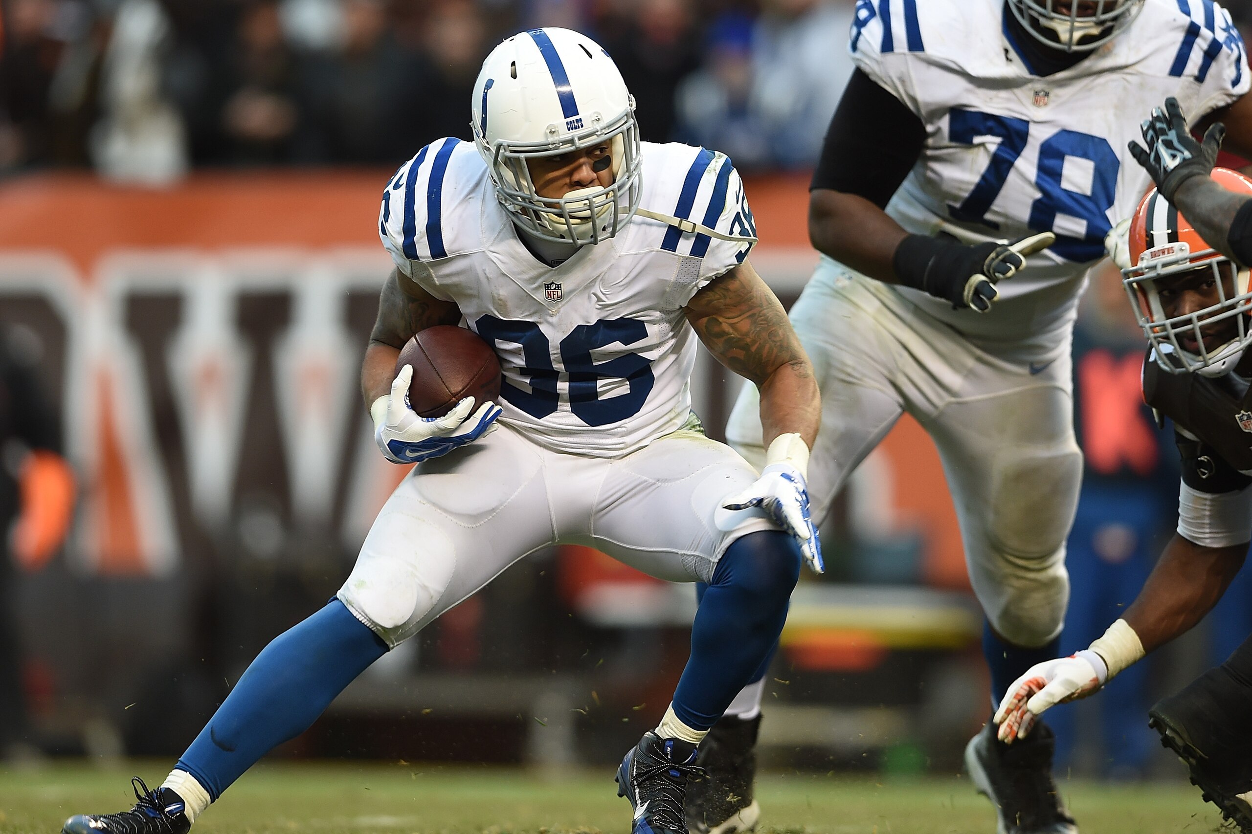CLEVELAND, OH - DECEMBER 07:  Dan Herron #36 of the Indianapolis Colts carries the ball for a first down to setup the game winning touchdown during the fourth quarter against the Cleveland Browns at FirstEnergy Stadium on December 7, 2014 in Cleveland, Oh