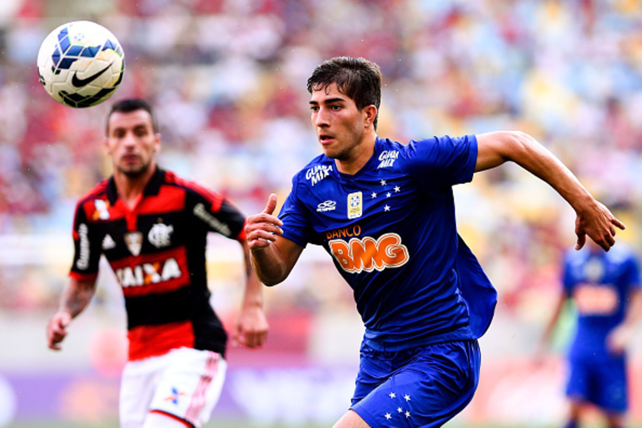 RIO DE JANEIRO, BRAZIL - OCTOBER 12:  Lucas Silva of Cruzeiro moves the ball against Canteros (L) of Flamengo during a match between Flamengo and Cruzeiro as part of Brasileirao Series A 2014 at Maracana Stadium on October 12, 2014 in Rio de Janeiro, Braz