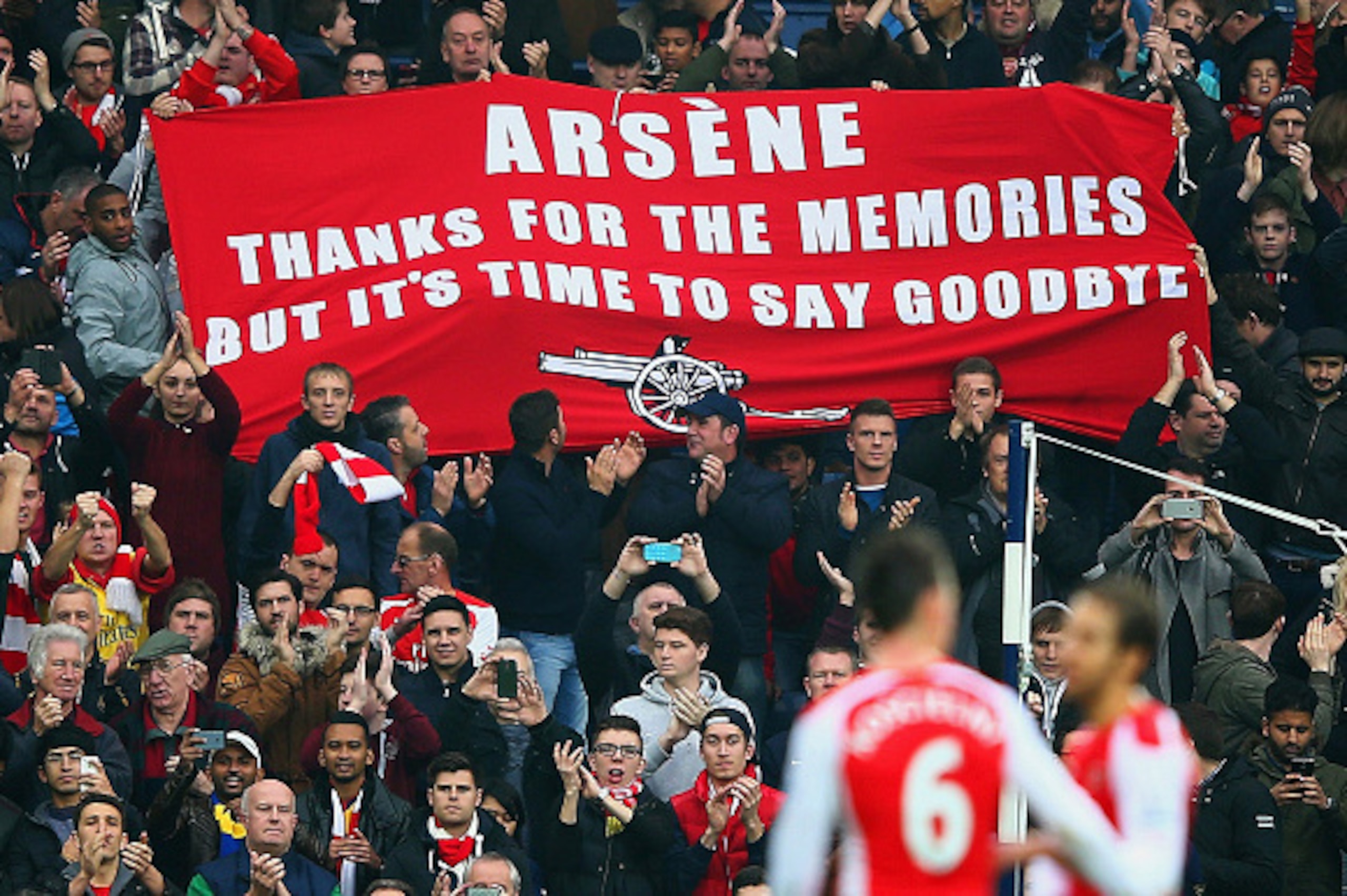 WEST BROMWICH, ENGLAND - NOVEMBER 29:   (EDITORS NOTE: This is a retransmission of image #459708260 with an alternative crop)   Arsenal fans hold up a banner for Arsene Wenger, manager of Arsenal during the Barclays Premier League match between West Bromw