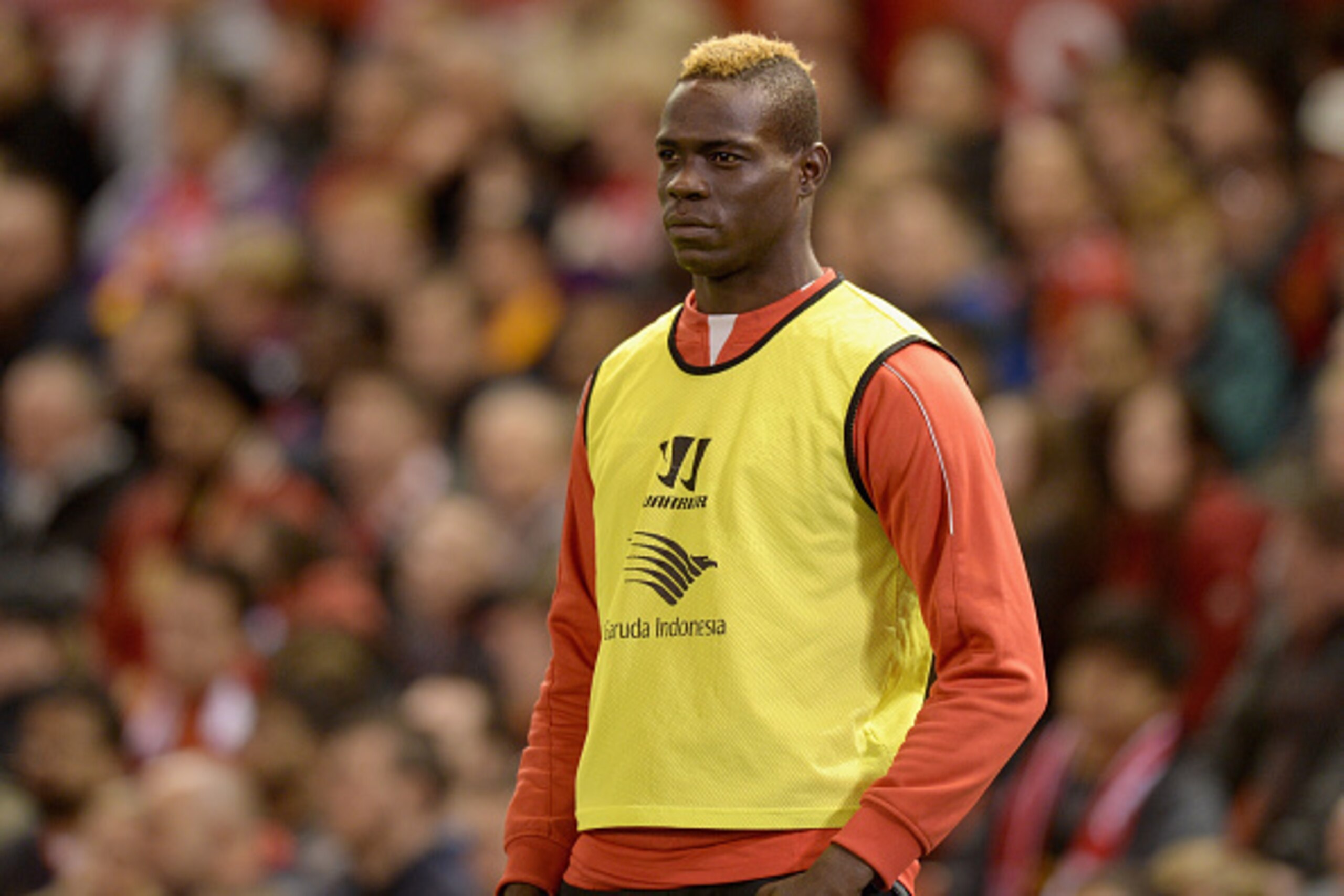 LIVERPOOL, ENGLAND - OCTOBER 28:  Mario Balotelli of Liverpool watches from the sidelines during the Capital One Cup Fourth Round match between Liverpool and Swansea City at Anfield on October 28, 2014 in Liverpool, England.  (Photo by Gareth Copley/Getty