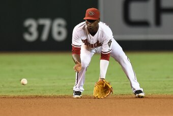 PHOENIX, AZ - AUGUST 29:  Didi Gregorius #1 of the Arizona Diamondbacks makes a play on a ground ball during the third inning against the Colorado Rockies at Chase Field on August 29, 2014 in Phoenix, Arizona.  (Photo by Norm Hall/Getty Images)