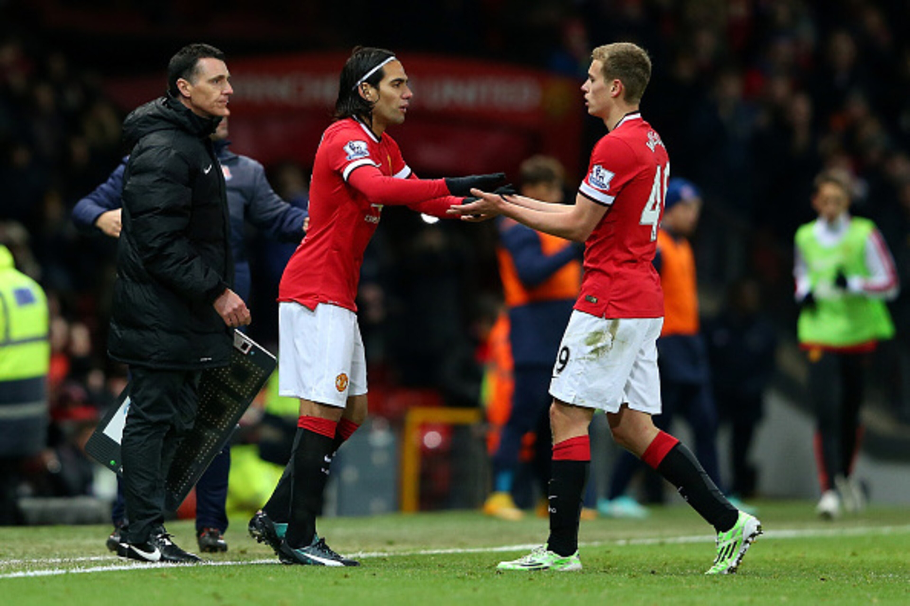 MANCHESTER, ENGLAND - DECEMBER 02:  Radamel Falcao of Manchester United comes on as a substitute for team-mate James Wilson (R) during the Barclays Premier League match between Manchester United and Stoke City at Old Trafford on December 2, 2014 in Manche