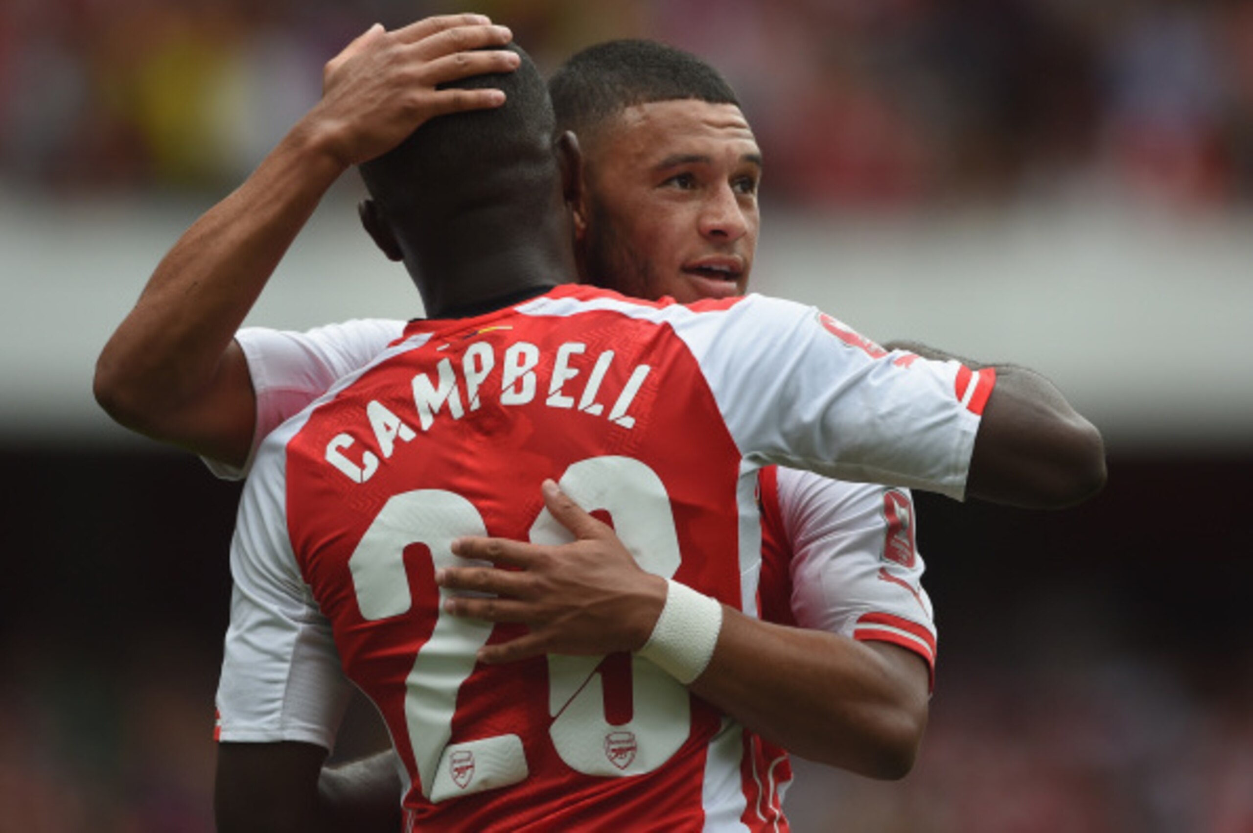 LONDON, ENGLAND - AUGUST 02: Joel Campbell of Arsenal celebrates his goal with team mate Alex Oxlade-Chamberlain during the Emirates Cup match between Arsenal and Benfica at the Emirates Stadium on August 2, 2014 in London, England.  (Photo by Michael Reg