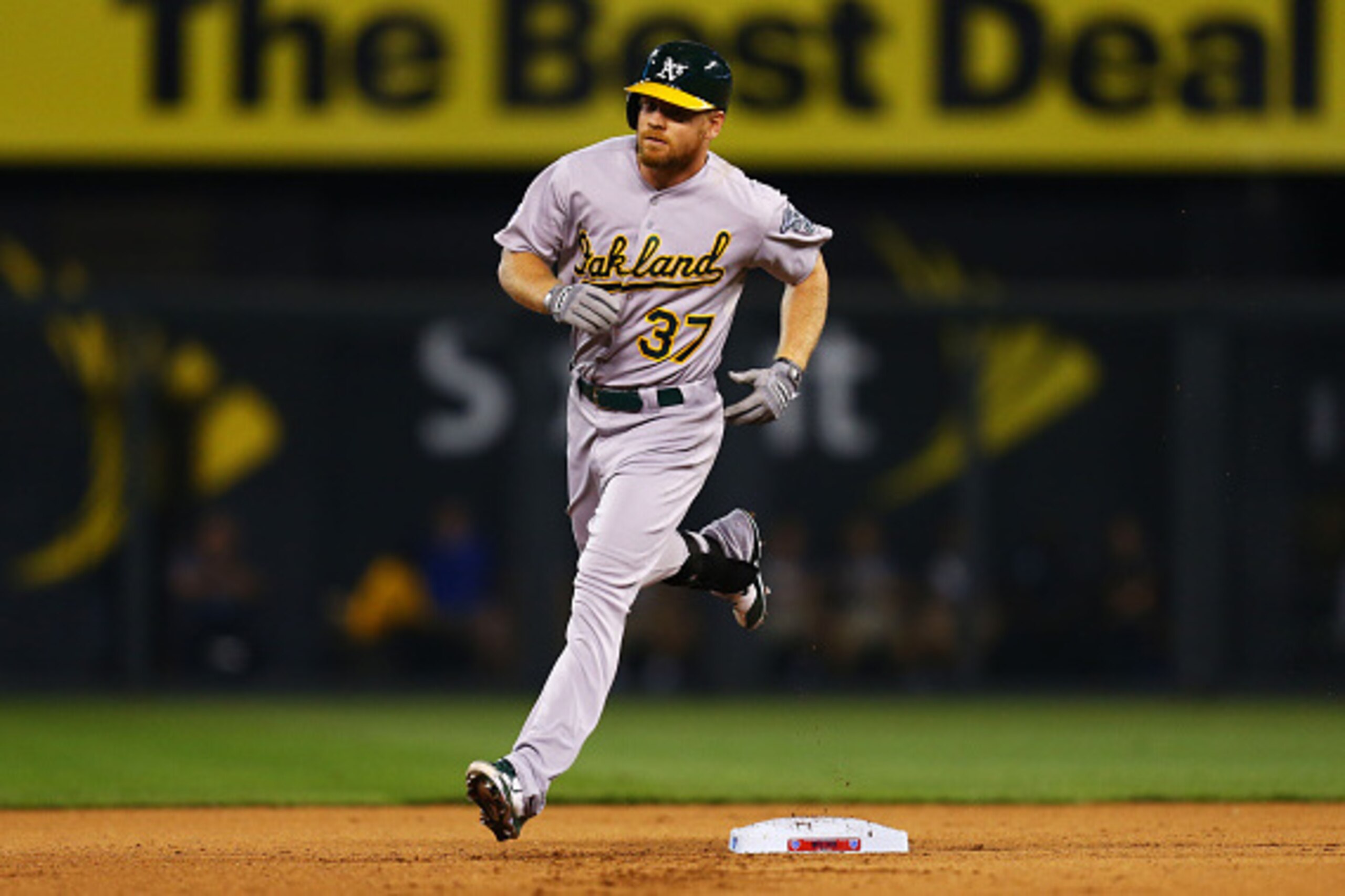 KANSAS CITY, MO - SEPTEMBER 30:  Brandon Moss #37 of the Oakland Athletics rounds the bases after his three-run home run in the sixth inning against the Kansas City Royals during the American League Wild Card game at Kauffman Stadium on September 30, 2014