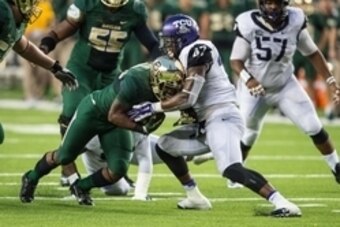 Oct 11, 2014; Waco, TX, USA; TCU Horned Frogs linebacker Paul Dawson (47) tackles Baylor Bears running back Shock Linwood (32) during the game at McLane Stadium. The Bears defeat Horned Frogs 61-58. Mandatory Credit: Jerome Miron-USA TODAY Sports