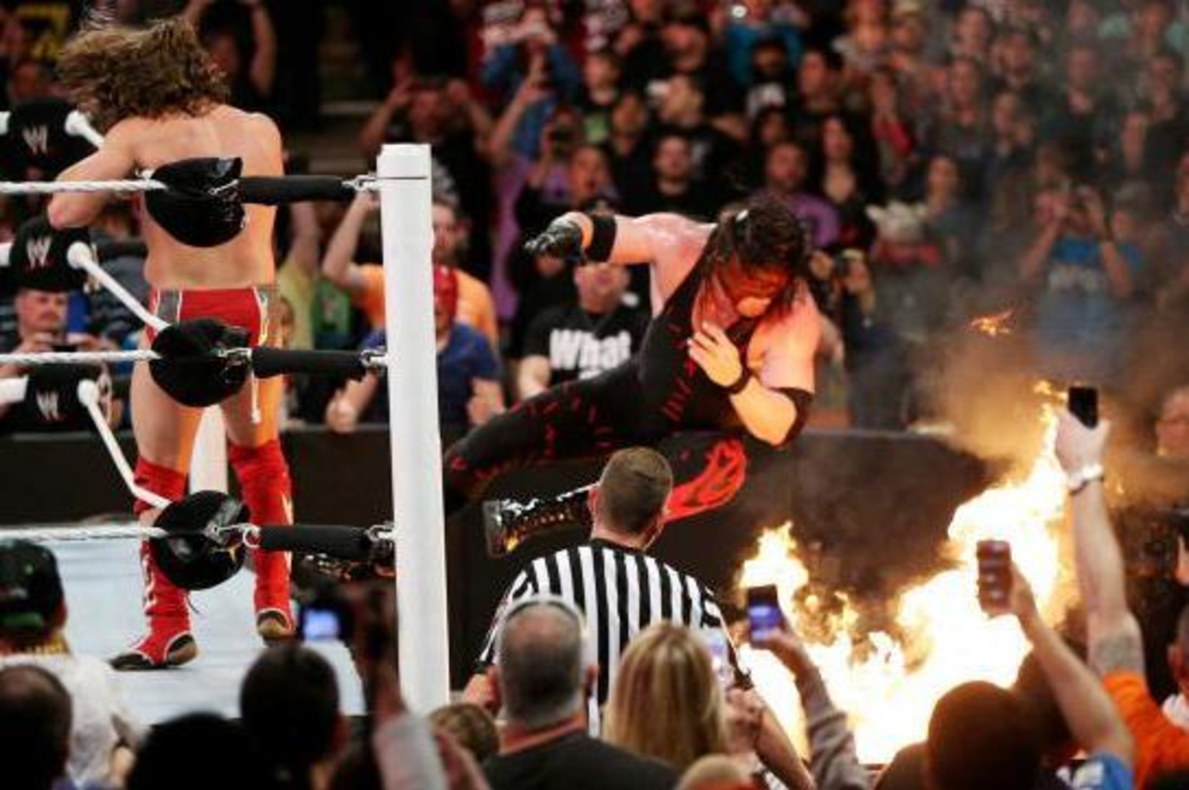 Daniel Bryan sends Kane into the flames at Extreme Rules. Daniel Bryan sends Kane into the flames at Extreme Rules.