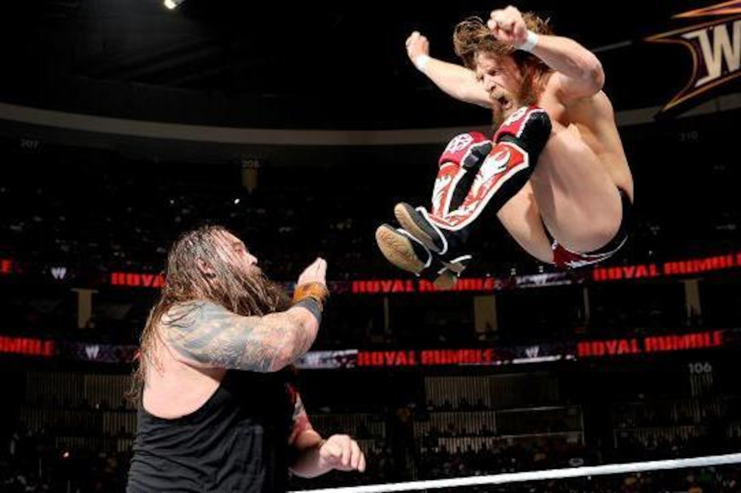 Daniel Bryan aims a missile dropkick at Bray Wyatt.