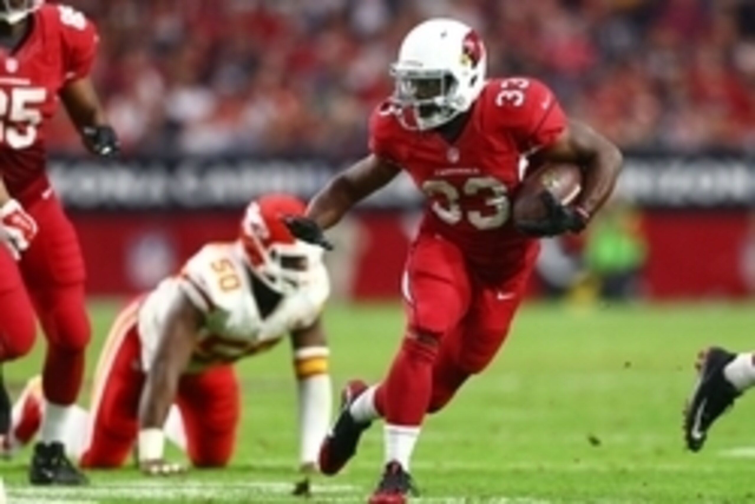Dec 7, 2014; Glendale, AZ, USA; Arizona Cardinals running back Kerwynn Williams (33) runs the ball against the Kansas City Chiefs at University of Phoenix Stadium. The Cardinals defeated the Chiefs 17-14. Mandatory Credit: Mark J. Rebilas-USA TODAY Sports Dec 7, 2014; Glendale, AZ, USA; Arizona Cardinals running back Kerwynn Williams (33) runs the ball against the Kansas City Chiefs at University of Phoenix Stadium. The Cardinals defeated the Chiefs 17-14. Mandatory Credit: Mark J. Rebilas-USA TODAY Sports