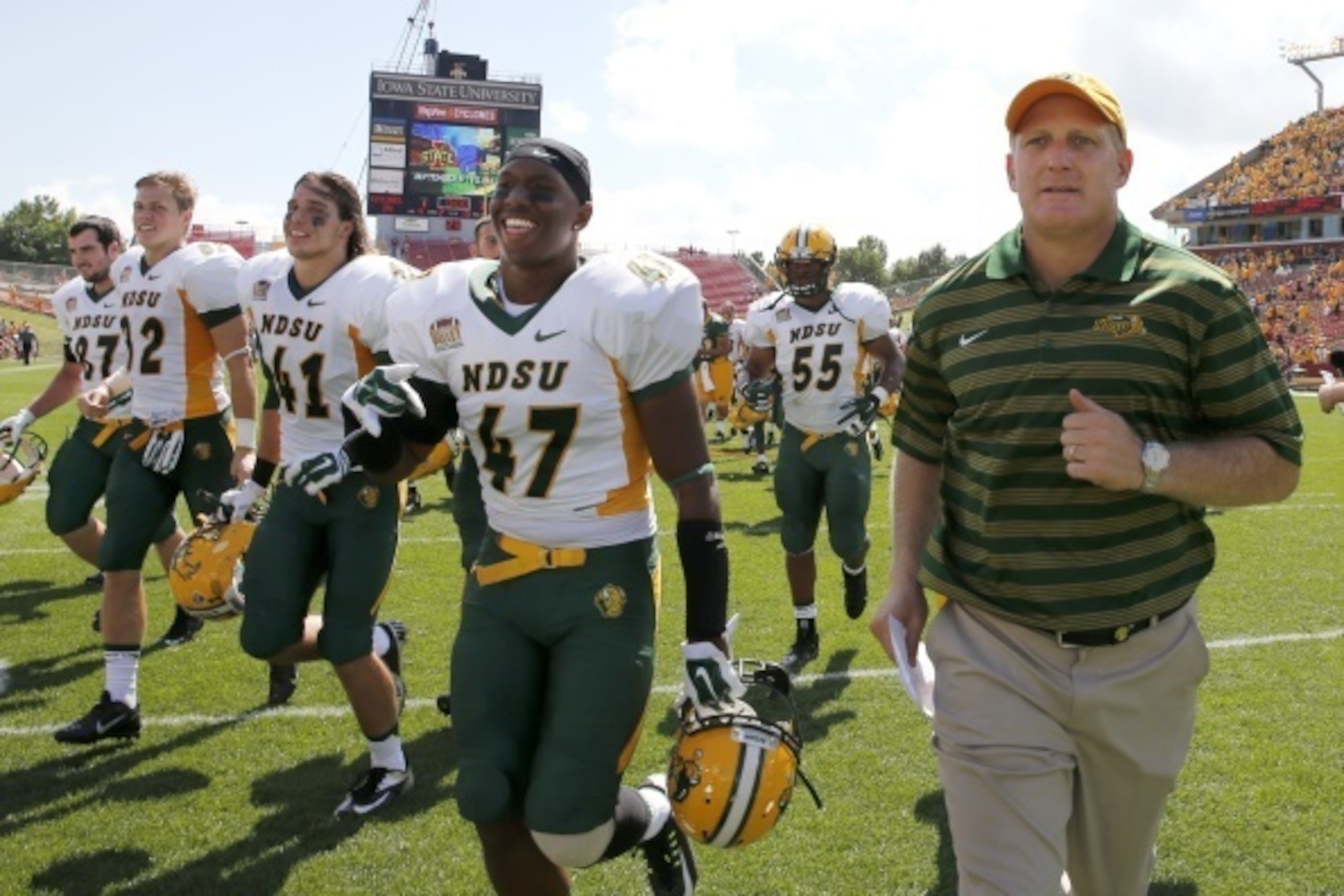 AMES, IA - AUGUST 30: Head coach Chris Klienman of the North Dakota State Bison leads his team off the field after the defeated the Iowa State Cyclones 34-14 at Jack Trice Stadium on August 30, 2014 in Ames, Iowa. North Dakota State defeated Iowa State 34
