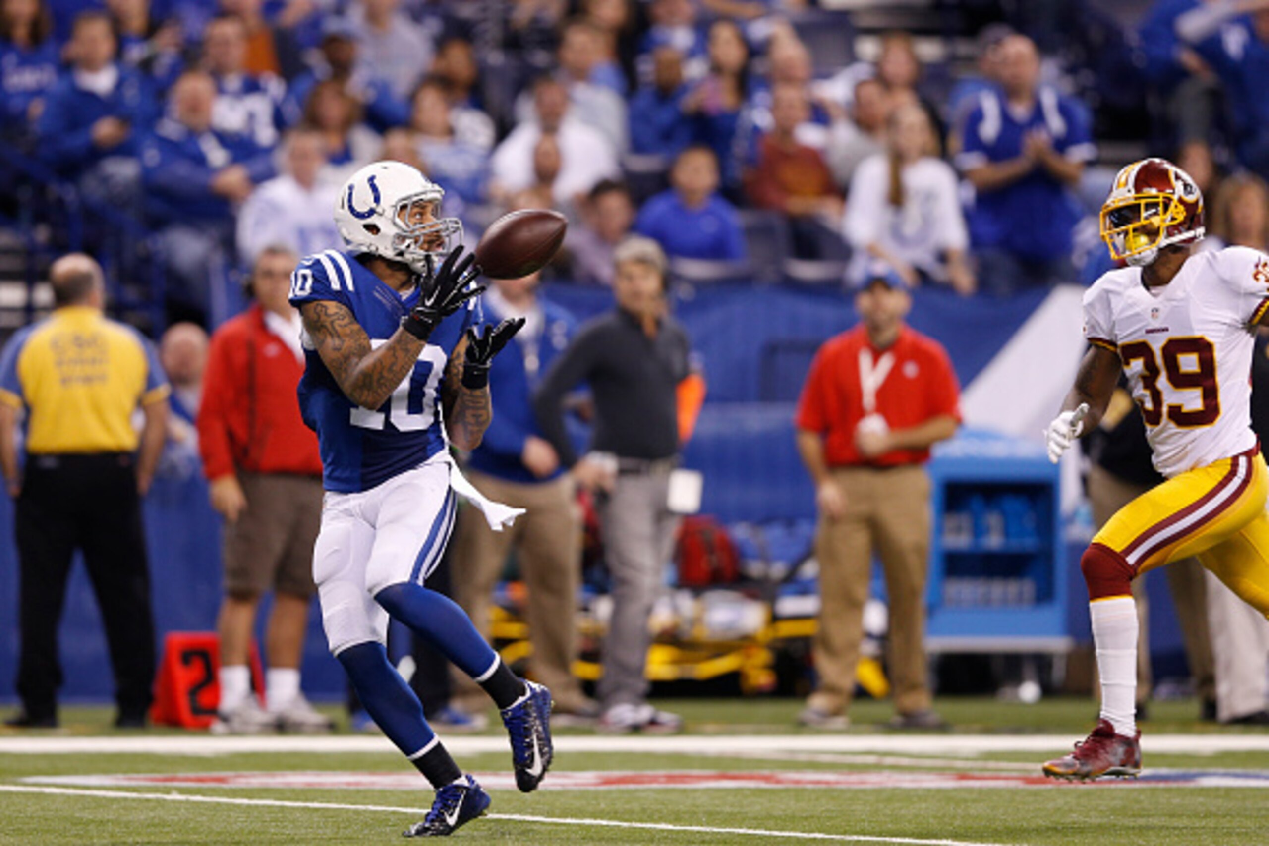 INDIANAPOLIS, IN - NOVEMBER 30: Donte Moncrief #10 of the Indianapolis Colts makes a 48-yard touchdown reception in the third quarter of the game against the Washington Redskins at Lucas Oil Stadium on November 30, 2014 in Indianapolis, Indiana. The Colts