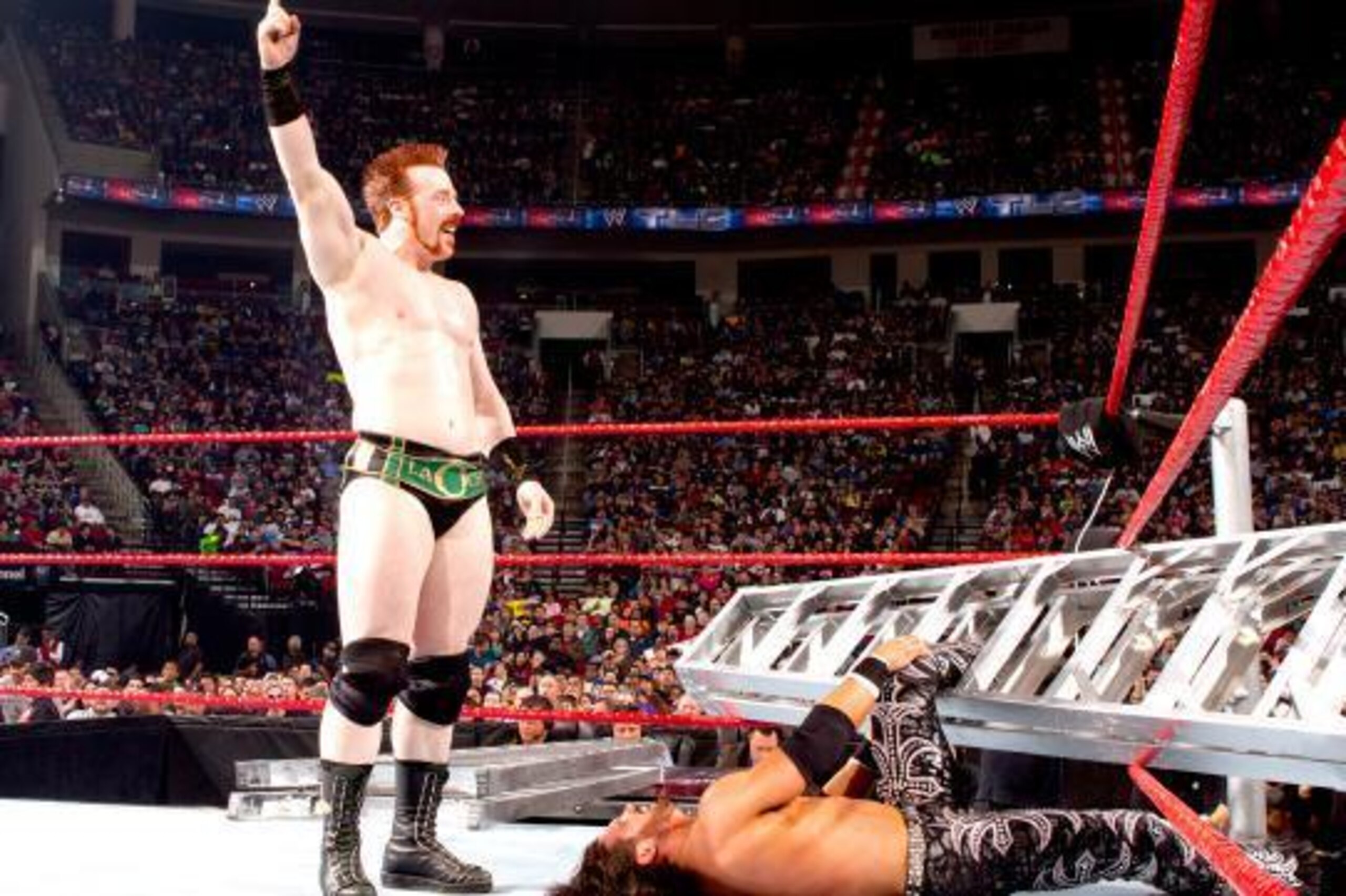 Sheamus gloats after felling John Morrison. Sheamus gloats after felling John Morrison.