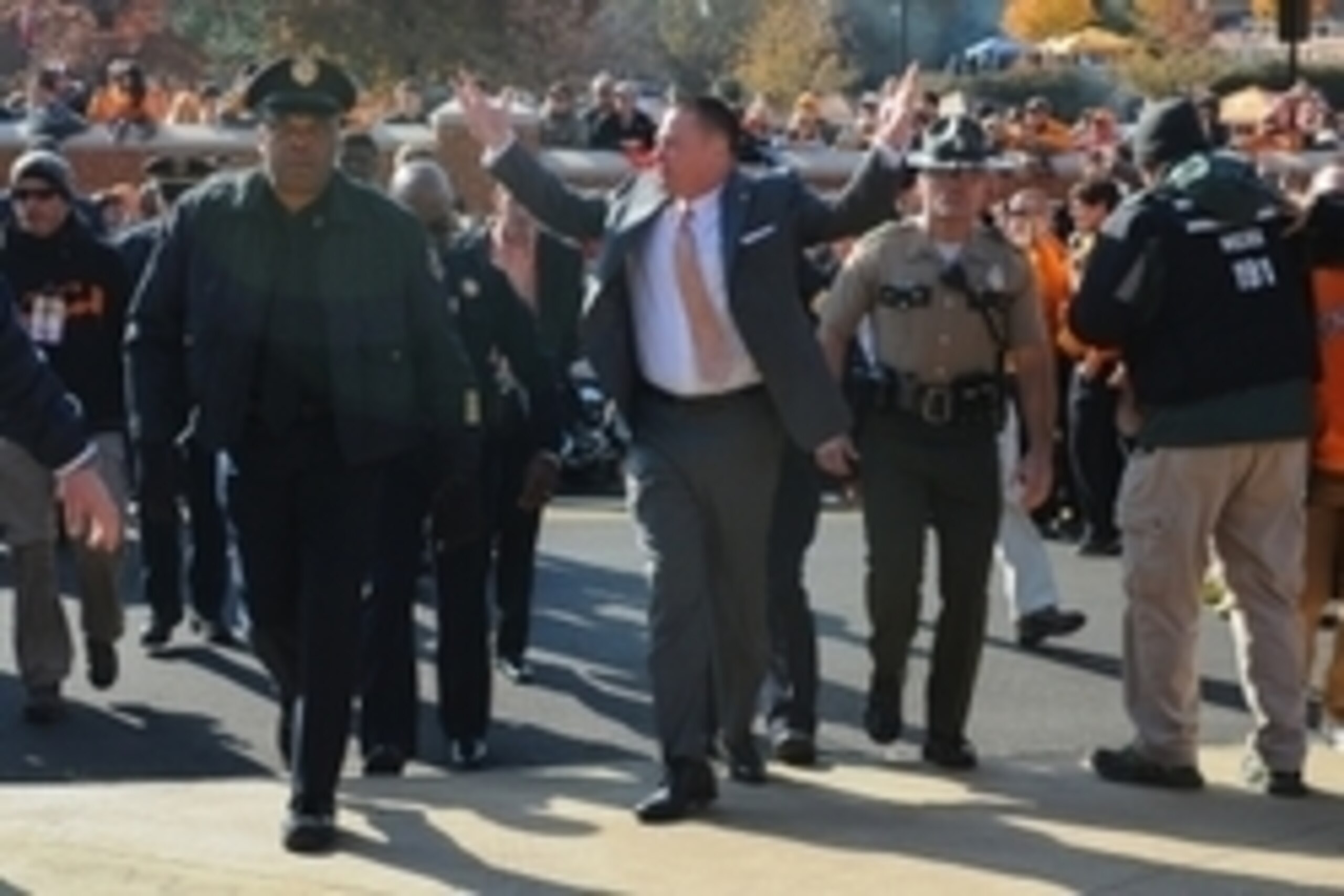 Nov 15, 2014; Knoxville, TN, USA; Tennessee Volunteers head coach Butch Jones (center) gestures to the fans during the Vol Walk prior to the game against the Kentucky Wildcats at Neyland Stadium. Mandatory Credit: Randy Sartin-USA TODAY Sports