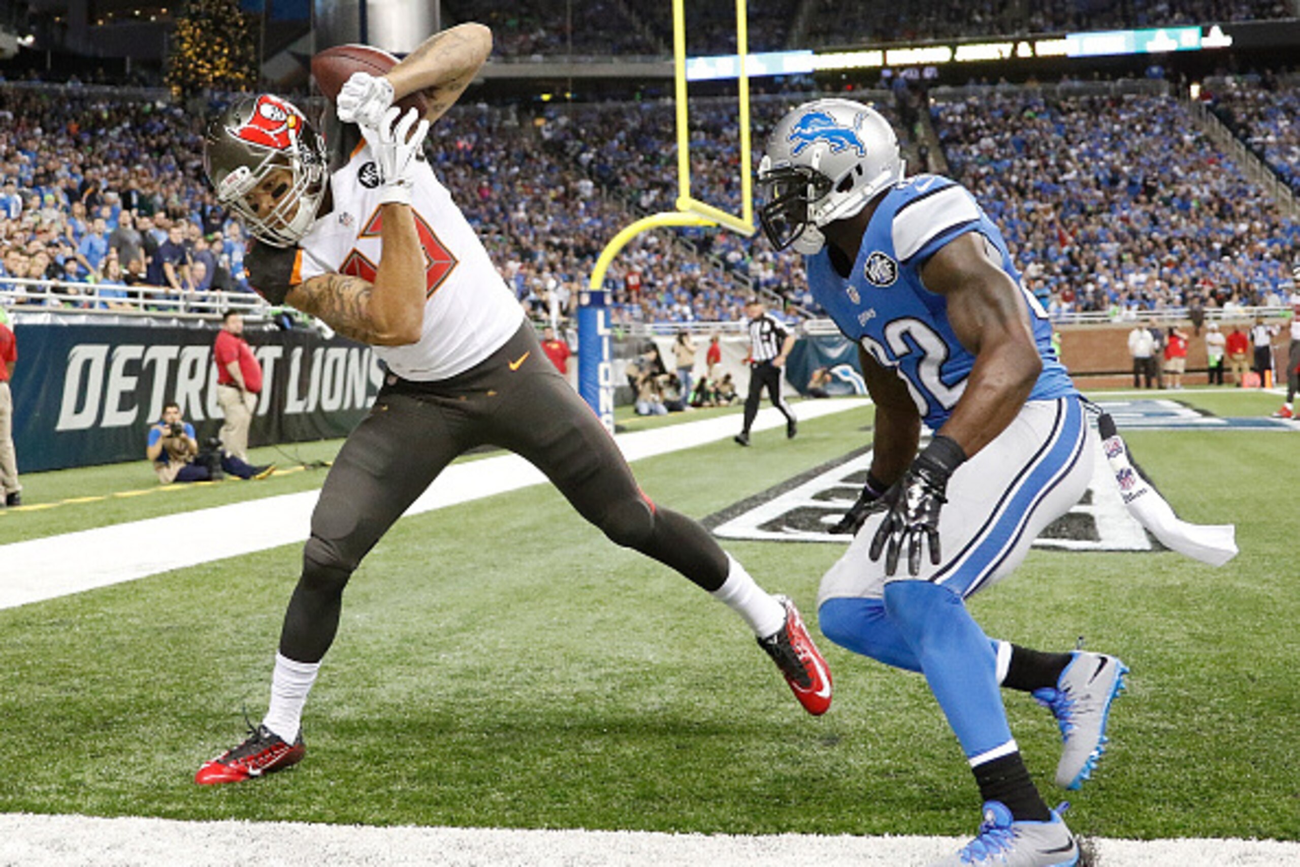 DETROIT, MI - DECEMBER 7: Mike Evans #13 of the Tampa Bay Buccaneers catches a fourth quarter touchdown in front of James Ihedigbo #32 of the Detroit Lions at Ford Field on December 7, 2014 in Detroit, Michigan. (Photo by Leon Halip/Getty Images) DETROIT, MI - DECEMBER 7: Mike Evans #13 of the Tampa Bay Buccaneers catches a fourth quarter touchdown in front of James Ihedigbo #32 of the Detroit Lions at Ford Field on December 7, 2014 in Detroit, Michigan. (Photo by Leon Halip/Getty Images)