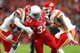 Dec 7, 2014; Glendale, AZ, USA; Arizona Cardinals running back Kerwynn Williams (33) runs the ball in the fourth quarter against the Kansas City Chiefs at University of Phoenix Stadium. The Cardinals defeated the Chiefs 17-14. Mandatory Credit: Mark J. Re