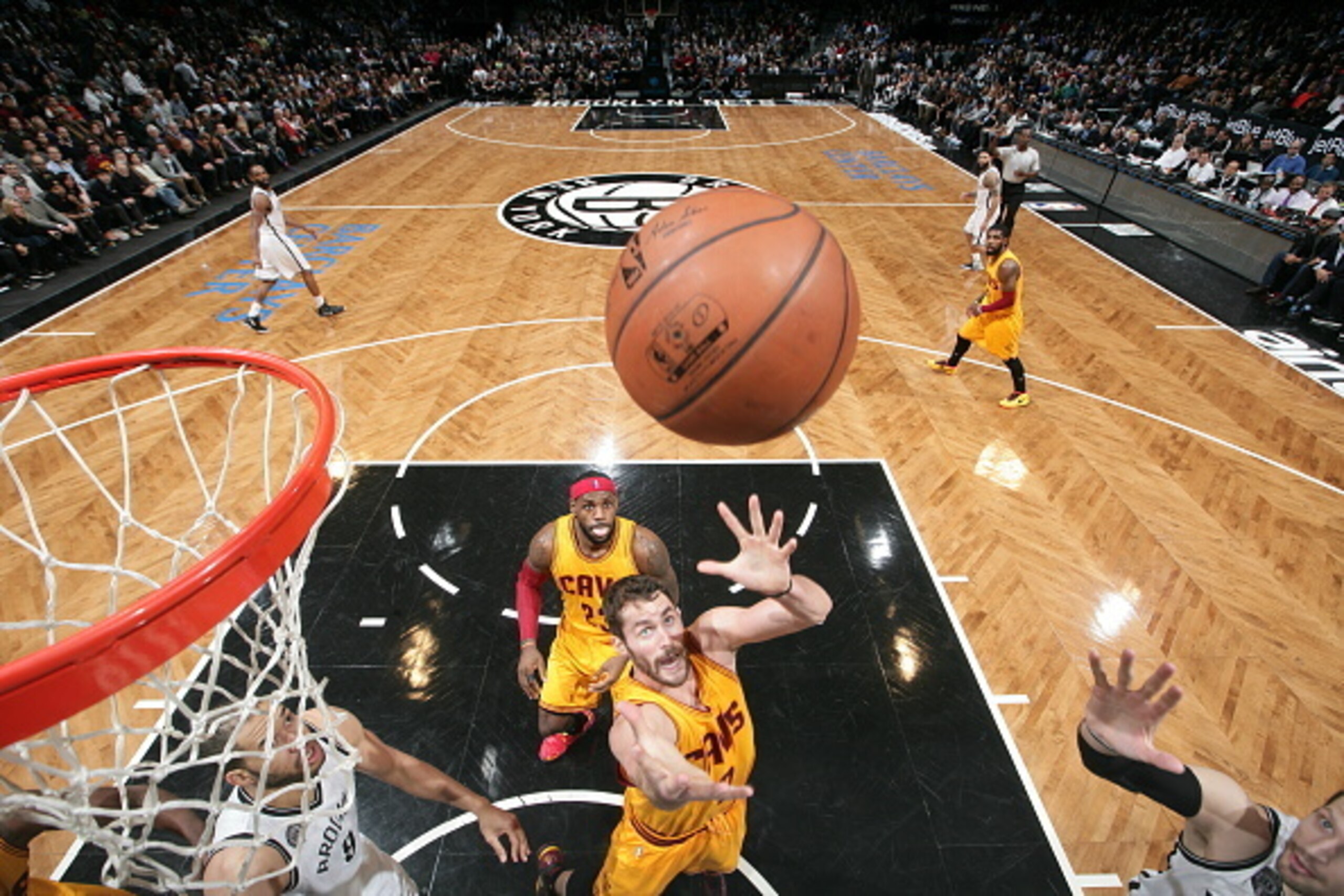 BROOKLYN, NY - DECEMBER 8:  Kevin Love #0 of the Cleveland Cavaliers goes up for a rebound against the Brooklyn Nets during the game on December 8, 2014 at Barclays Center in Brooklyn, New York. NOTE TO USER: User expressly acknowledges and agrees that, b