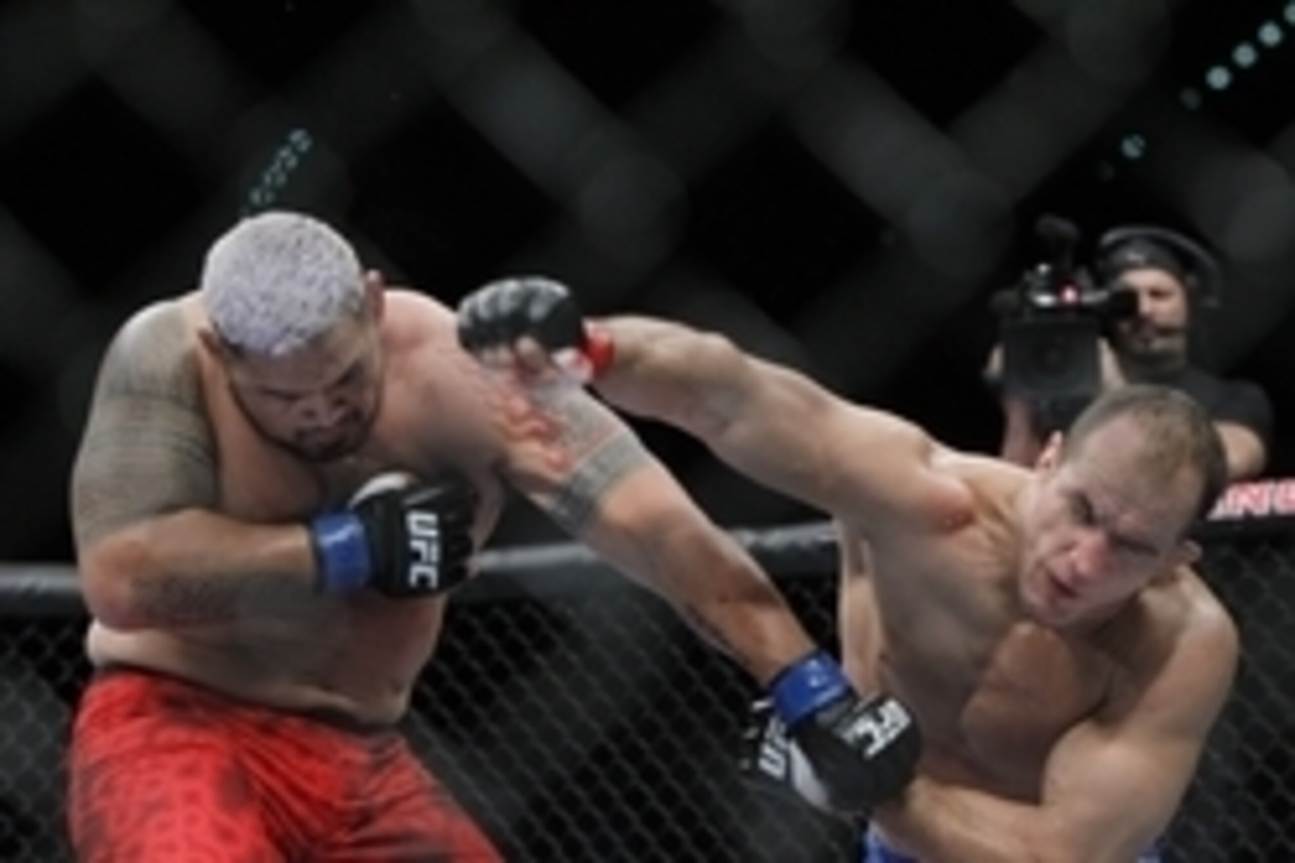 May 25, 2013; Las Vegas, NV, USA; Junior dos Santos lands a punch on Mark Hunt during UFC 160 at the MGM Grand Garden Arena. Mandatory Credit: Gary A. Vasquez-USA TODAY Sports