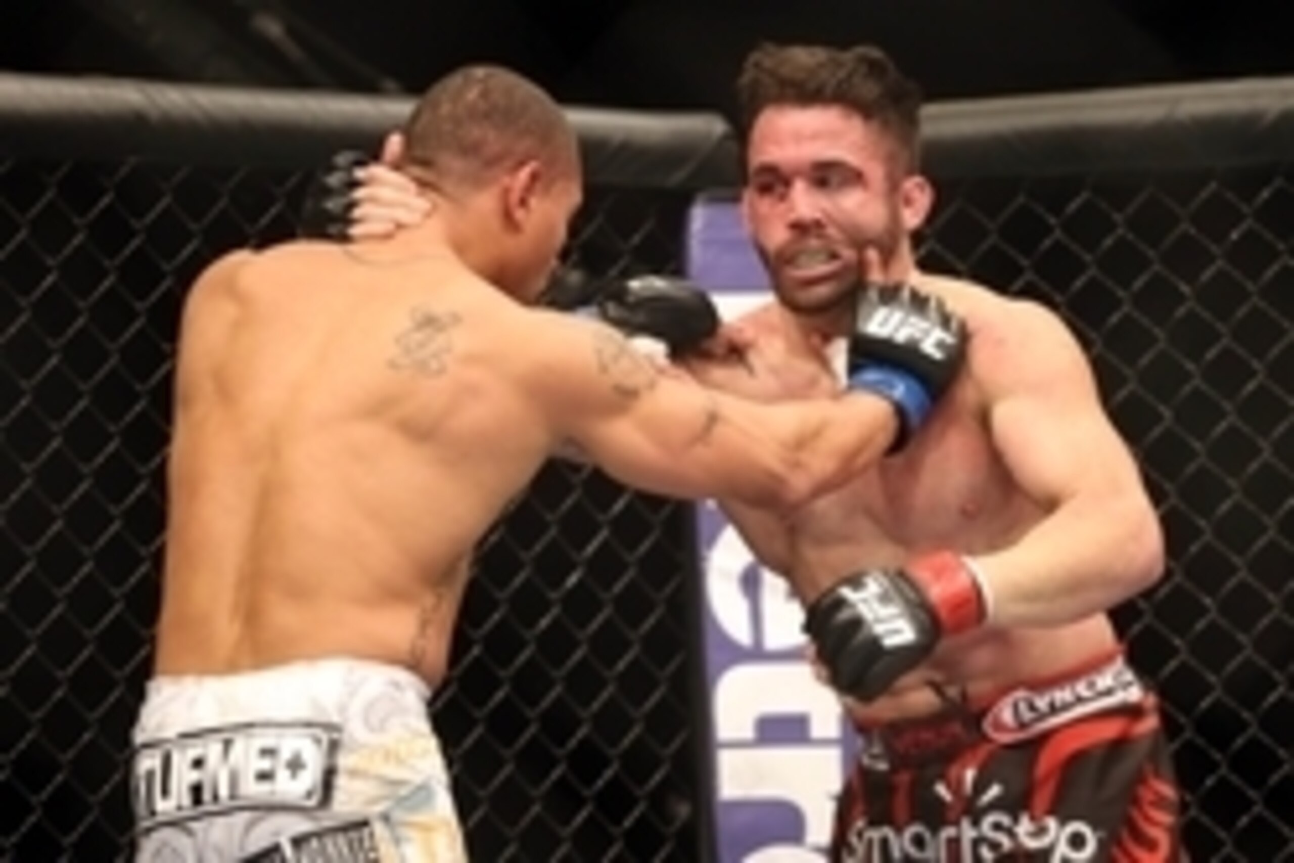 Feb 1, 2014; Newark, NJ, USA; Jamie Varner (red gloves) fights Abel Trujillo (blue gloves) during UFC 169 at Prudential Center. Mandatory Credit: Joe Camporeale-USA TODAY Sports