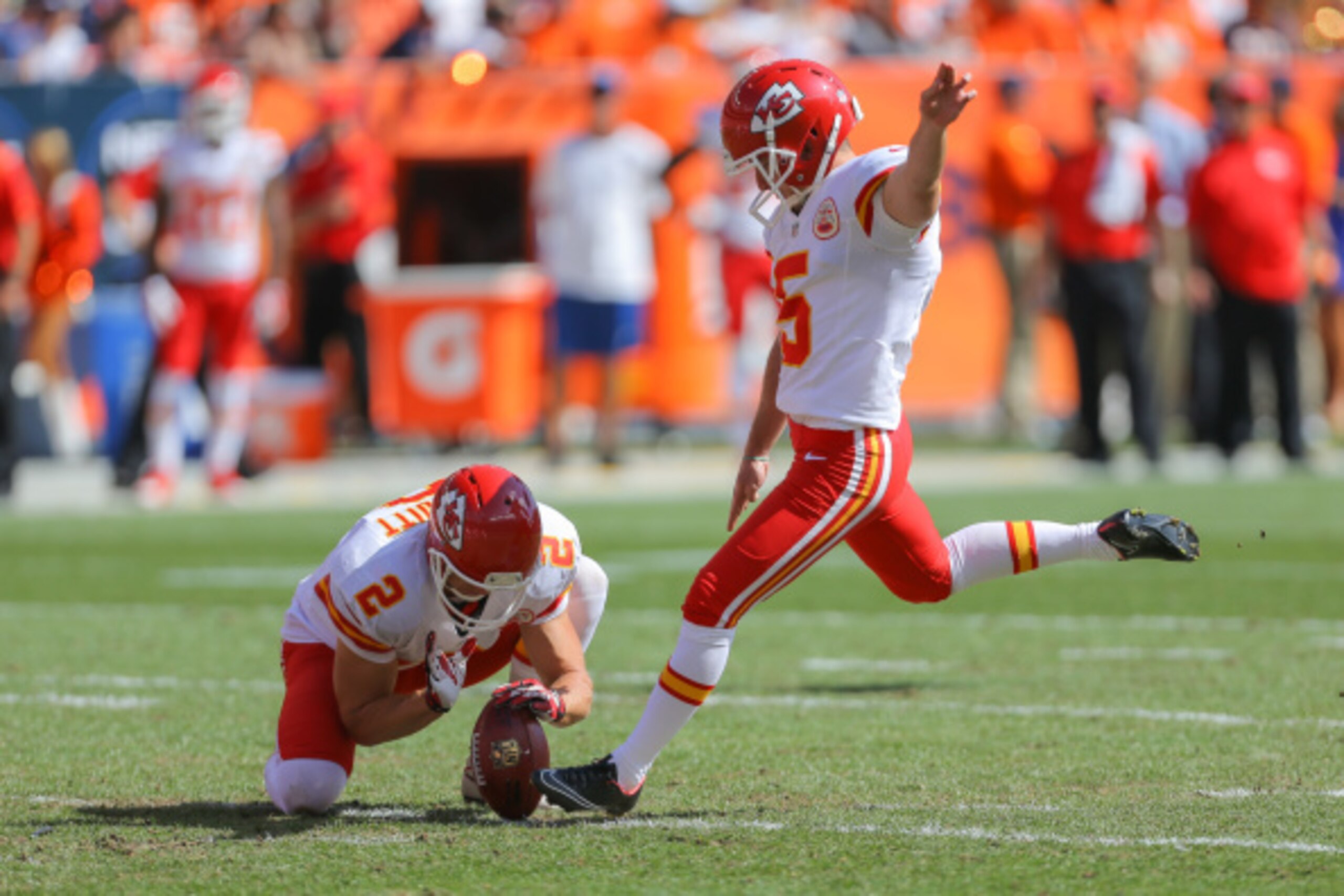 DENVER, CO - SEPTEMBER 14:  Kicker Cairo Santos #5 of the Kansas City Chiefs kicks a 45 yard first quarter field goal as punter Dustin Colquitt #2 holds against the Denver Broncos during a game at Sports Authority Field at Mile High on September 14, 2014 