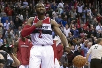 Dec 8, 2014; Washington, DC, USA; Washington Wizards guard John Wall (2) celebrates after scoring the game tying basket during the second overtime against the Boston Celtics at Verizon Center. Washington Wizards defeated Boston Celtics 133-132 in double o