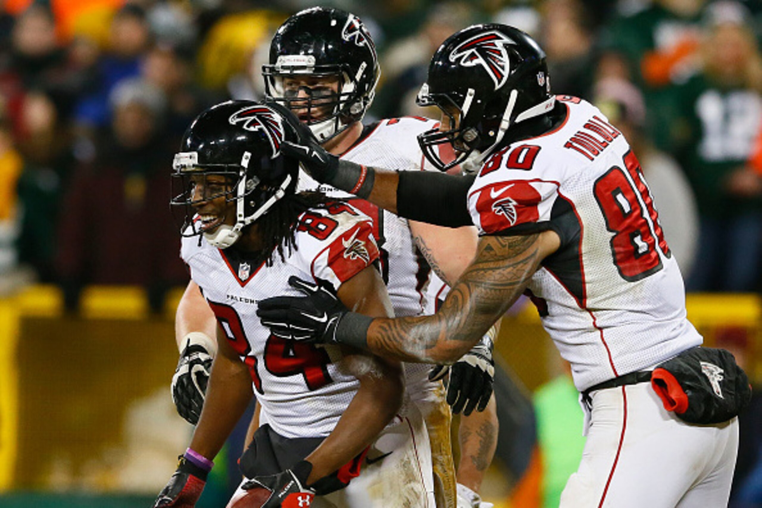 GREEN BAY, WI - DECEMBER 08:  Roddy White #84 of the Atlanta Falcons celebrates a touchdown in the fourth quarter against the Green Bay Packers at Lambeau Field on December 8, 2014 in Green Bay, Wisconsin.  (Photo by Kevin C. Cox/Getty Images)