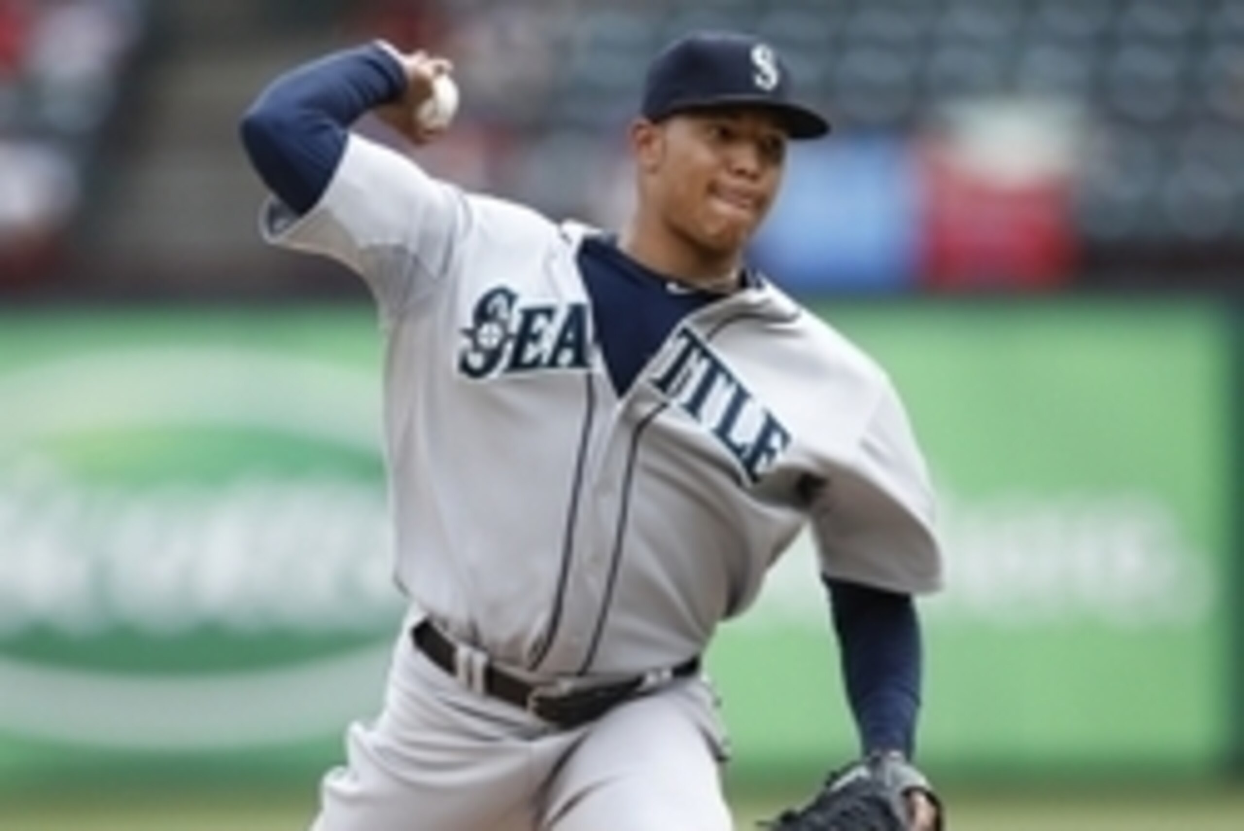 Sep 7, 2014; Arlington, TX, USA; Seattle Mariners starting pitcher Taijuan Walker (32) delivers a pitch to the Texas Rangers during the seventh inning of a baseball game at Globe Life Park in Arlington. The Rangers won 1-0. Mandatory Credit: Jim Cowsert-U