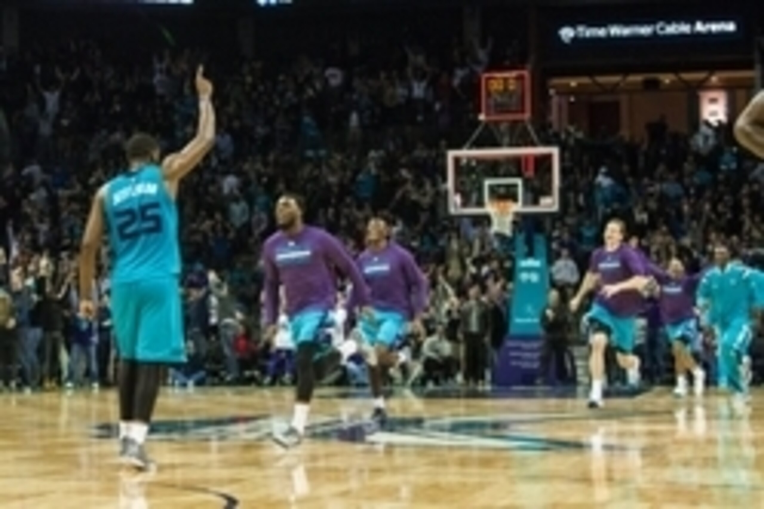 Dec 5, 2014; Charlotte, NC, USA; The Charlotte Hornets players run onto the court after defeating the New York Knicks at Time Warner Cable Arena. Hornets defeated the Knicks 103-102. Mandatory Credit: Jeremy Brevard-USA TODAY Sports