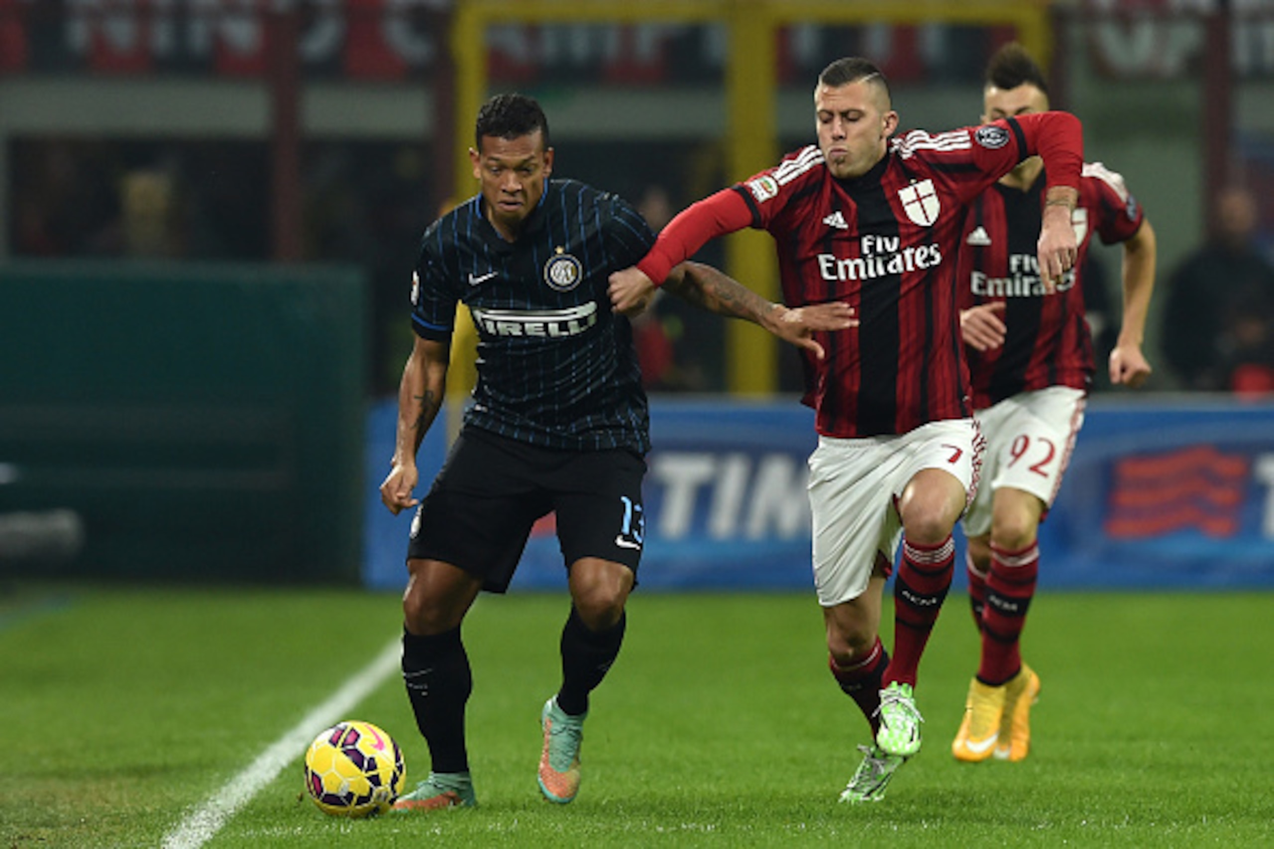 MILAN, ITALY - NOVEMBER 23:  Jeremy Menez (R) of AC Milan competes with Fredy Guarin of FC Internazionale Milano during the Serie A match between AC Milan and FC Internazionale Milano at Stadio Giuseppe Meazza on November 23, 2014 in Milan, Italy.  (Photo