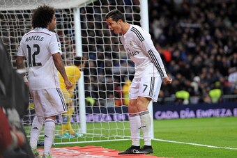 MADRID, SPAIN - DECEMBER 06:  Cristiano Ronaldo of Real Madrid celebrates with Marcelo after scoring Real's 3rd goal during the La Liga match between Real Madrid CF and Celta Vigo at Estadio Santiago Bernabeu on December 6, 2014 in Madrid, Spain.  (Photo 