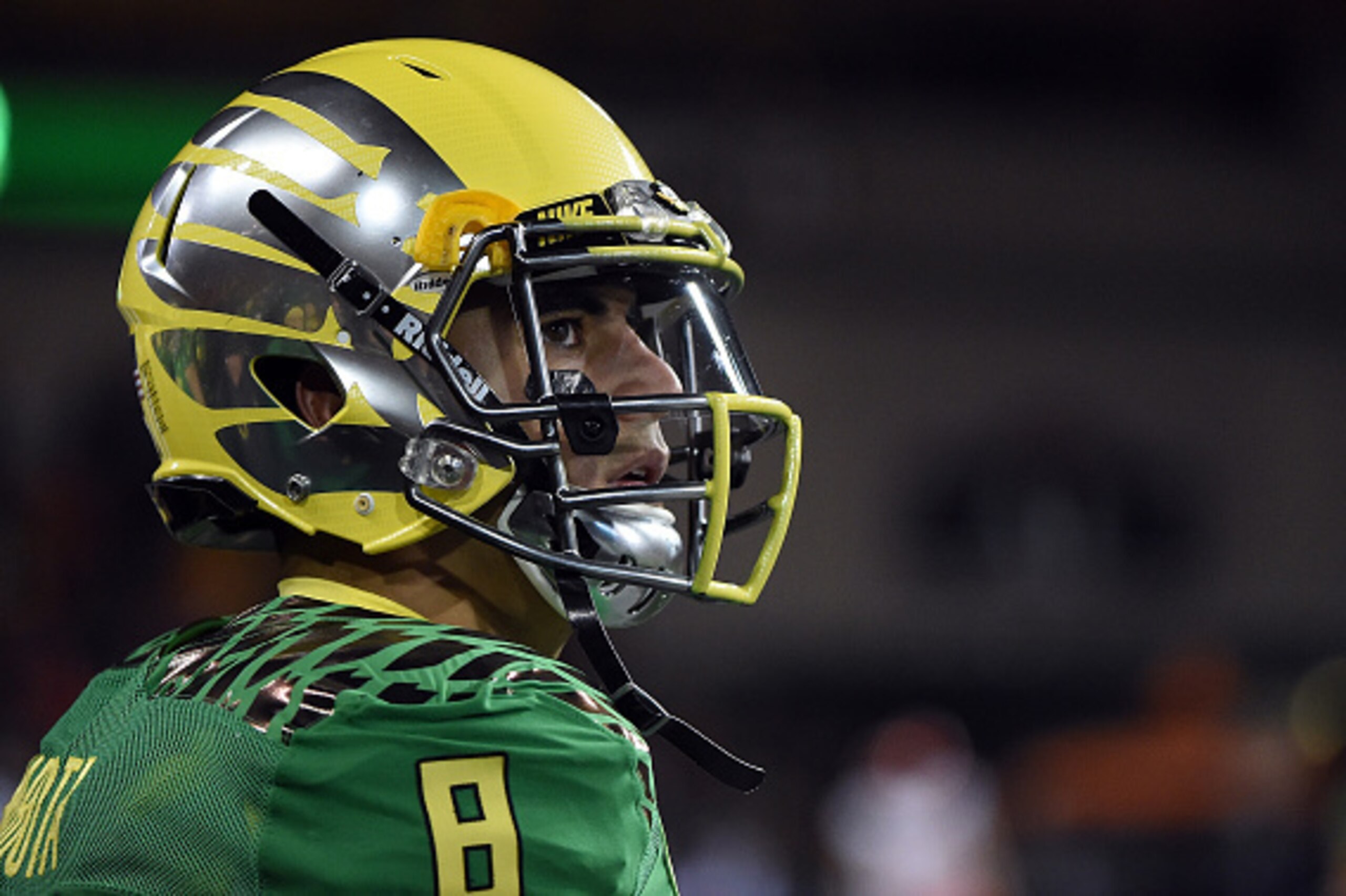 CORVALLIS, OR - NOVEMBER 29: Quarterback Marcus Mariota #8 of the Oregon Ducks looks out from the bench during the fourth quarter of the game against the Oregon State Beavers at Reser Stadium on November 29, 2014 in Corvallis, Oregon. (Photo by Steve Dyke