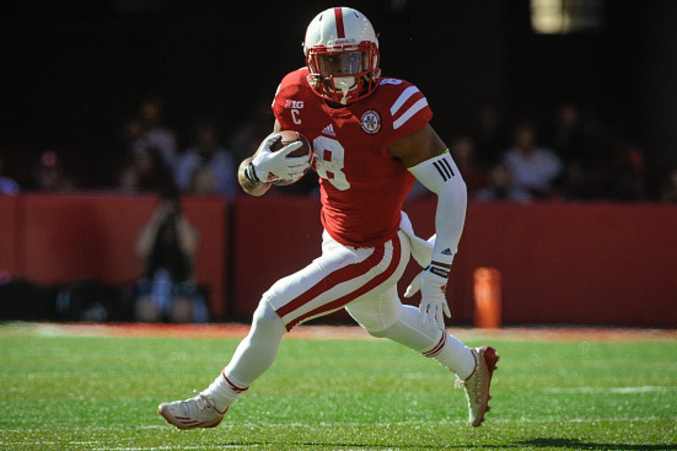 LINCOLN, NE - OCTOBER 25: Running back Ameer Abdullah #8 of the Nebraska Cornhuskers runs for a touchdown during the game against the Rutgers Scarlet Knights at Memorial Stadium on October 25, 2014 in Lincoln, Nebraska. Abdullah set a school record for ca
