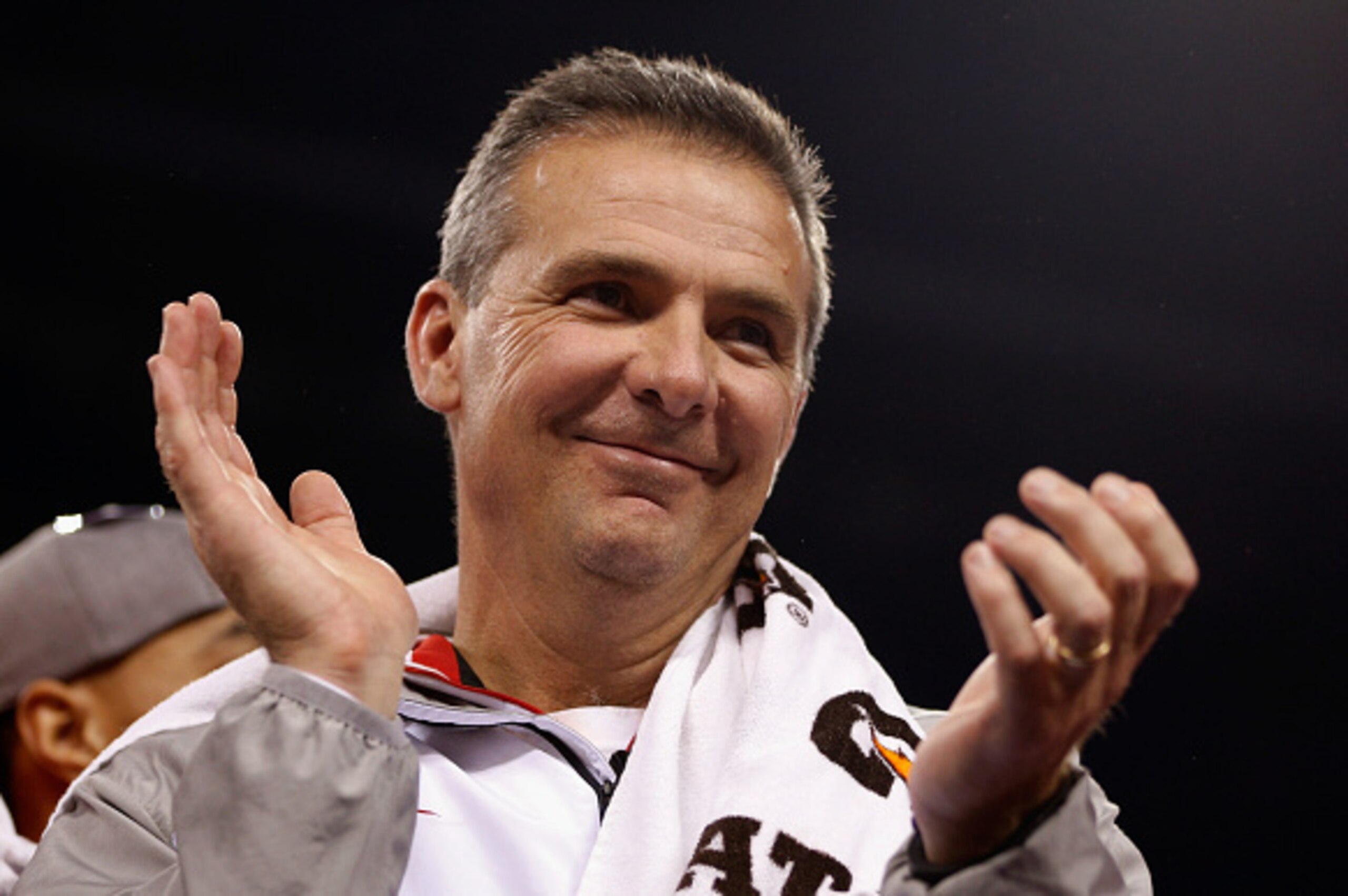 INDIANAPOLIS, IN - DECEMBER 06:  Head coach Urban Meyer of the Ohio State Buckeyes celebrates his team's 59-0 win over the Wisconsin Badgers in the Big Ten Championship at Lucas Oil Stadium on December 6, 2014 in Indianapolis, Indiana.  (Photo by Joe Robb