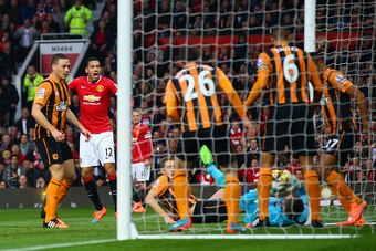 MANCHESTER, ENGLAND - NOVEMBER 29: Chris Smalling of Manchester United scores the opening goal  during the Barclays Premier League match between Manchester United and Hull City at Old Trafford on November 29, 2014 in Manchester, England.  (Photo by Matthe