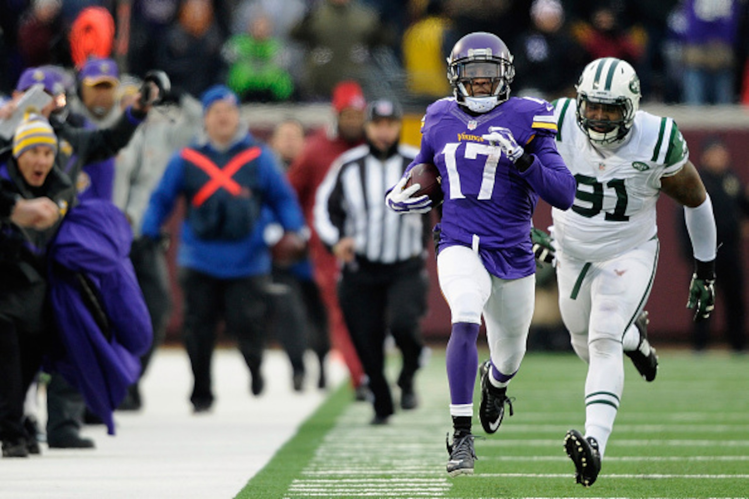 MINNEAPOLIS, MN - DECEMBER 7: Jarius Wright #17 of the Minnesota Vikings carries the ball for a touchdown as Sheldon Richardson #91 gives chase during overtime of the New York Jets  of the game on December 7, 2014 at TCF Bank Stadium in Minneapolis, Minne