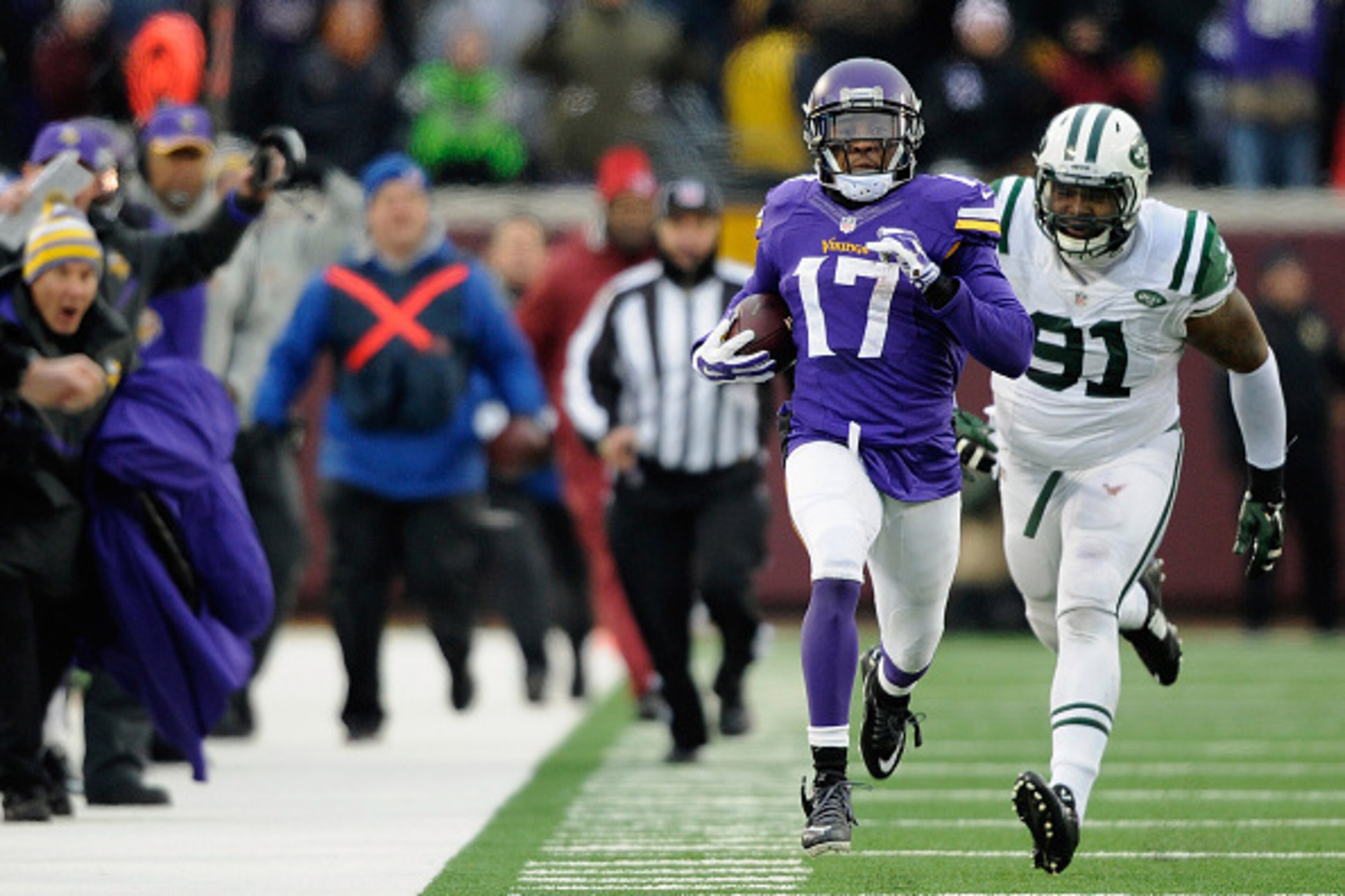 MINNEAPOLIS, MN - DECEMBER 7: Jarius Wright #17 of the Minnesota Vikings carries the ball for a touchdown as Sheldon Richardson #91 gives chase during overtime of the New York Jets  of the game on December 7, 2014 at TCF Bank Stadium in Minneapolis, Minne