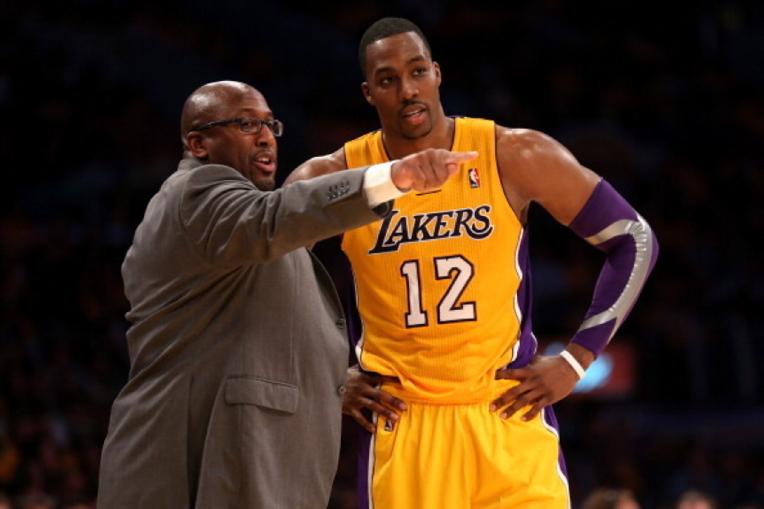 LOS ANGELES, CA - OCTOBER 30:  Head coach Mike Brown of the Los Angeles Lakers  confers with Dwight Howard #12 of the Dallas Mavericks at Staples Center on October 30, 2012 in Los Angeles, California.  The Mavericks won 99-91.  NOTE TO USER: User expressl