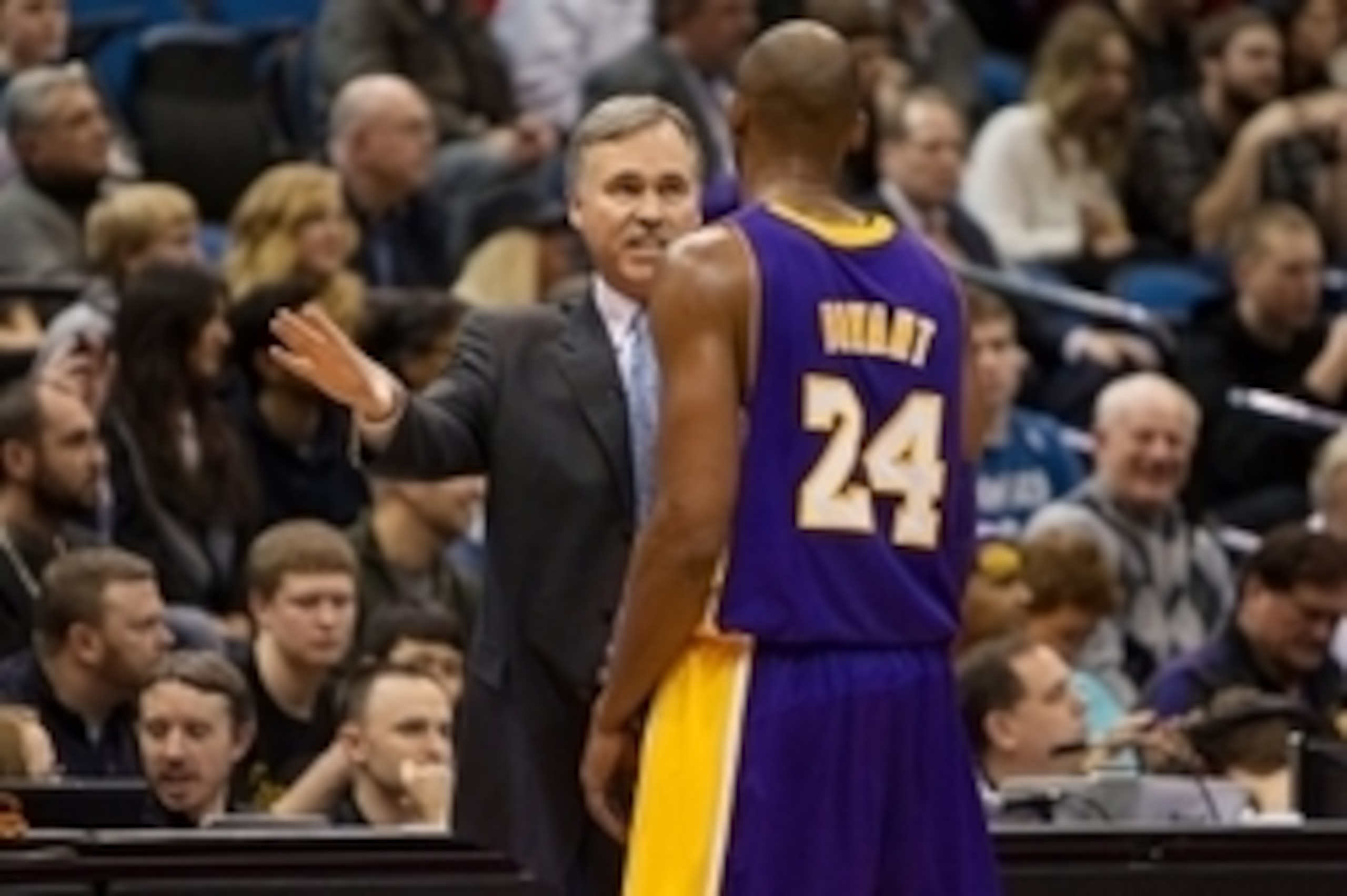Feb 1, 2013; Minneapolis, MN, USA; Los Angeles Lakers head coach Mike D'Antoni (left) talks with guard Kobe Bryant (right) during the third quarter against the Minnesota Timberwolves at the Target Center. The Lakers defeated the Timberwolves 111-100. Mand