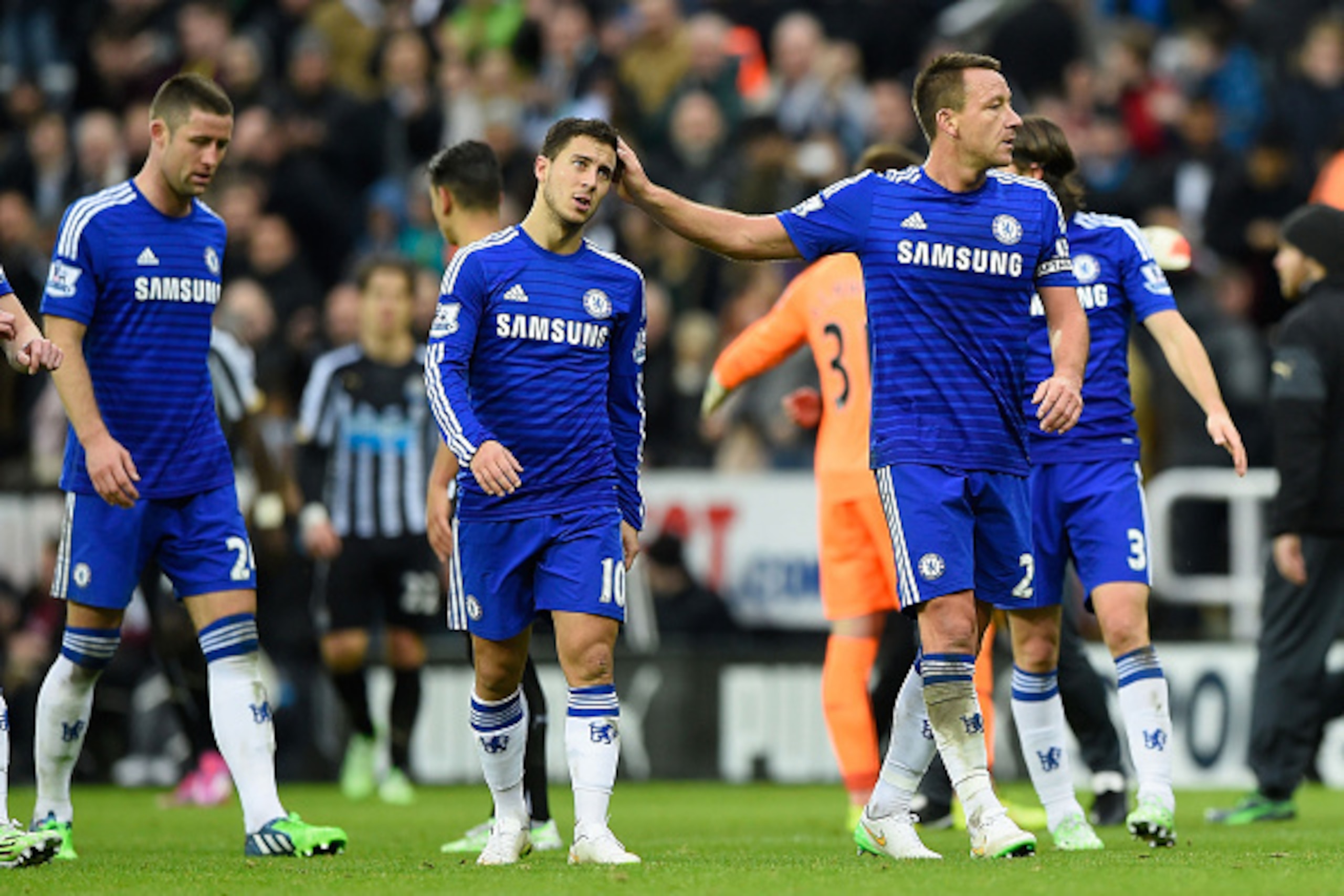 NEWCASTLE UPON TYNE, ENGLAND - DECEMBER 06:  Dejected Chelsea players Eden Hazard and John Terry walk off the pitch following their team's defeat during the Barclays Premier League match between Newcastle United and Chelsea at St James' Park on December 6