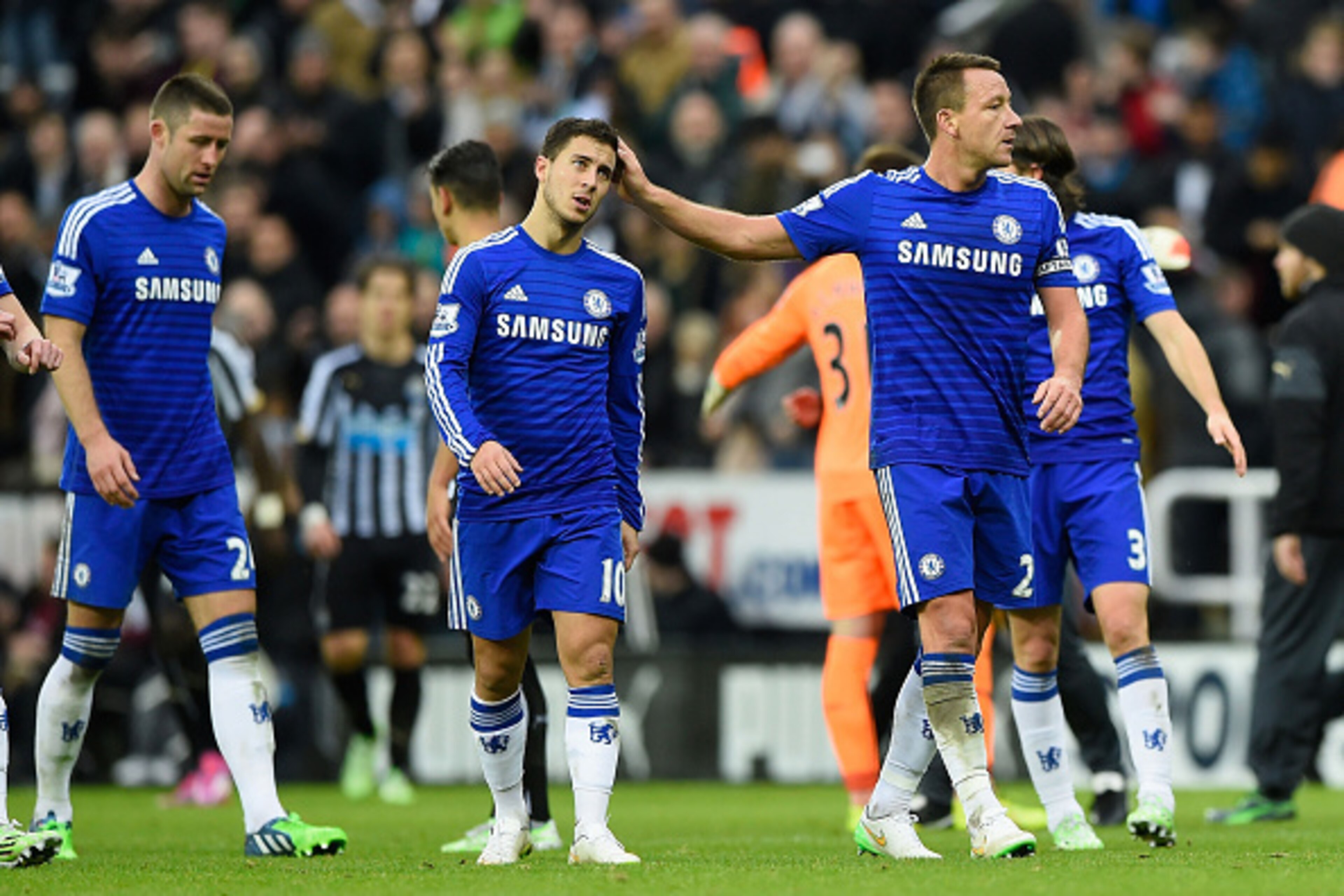 NEWCASTLE UPON TYNE, ENGLAND - DECEMBER 06:  Dejected Chelsea players Eden Hazard and John Terry walk off the pitch following their team's defeat during the Barclays Premier League match between Newcastle United and Chelsea at St James' Park on December 6