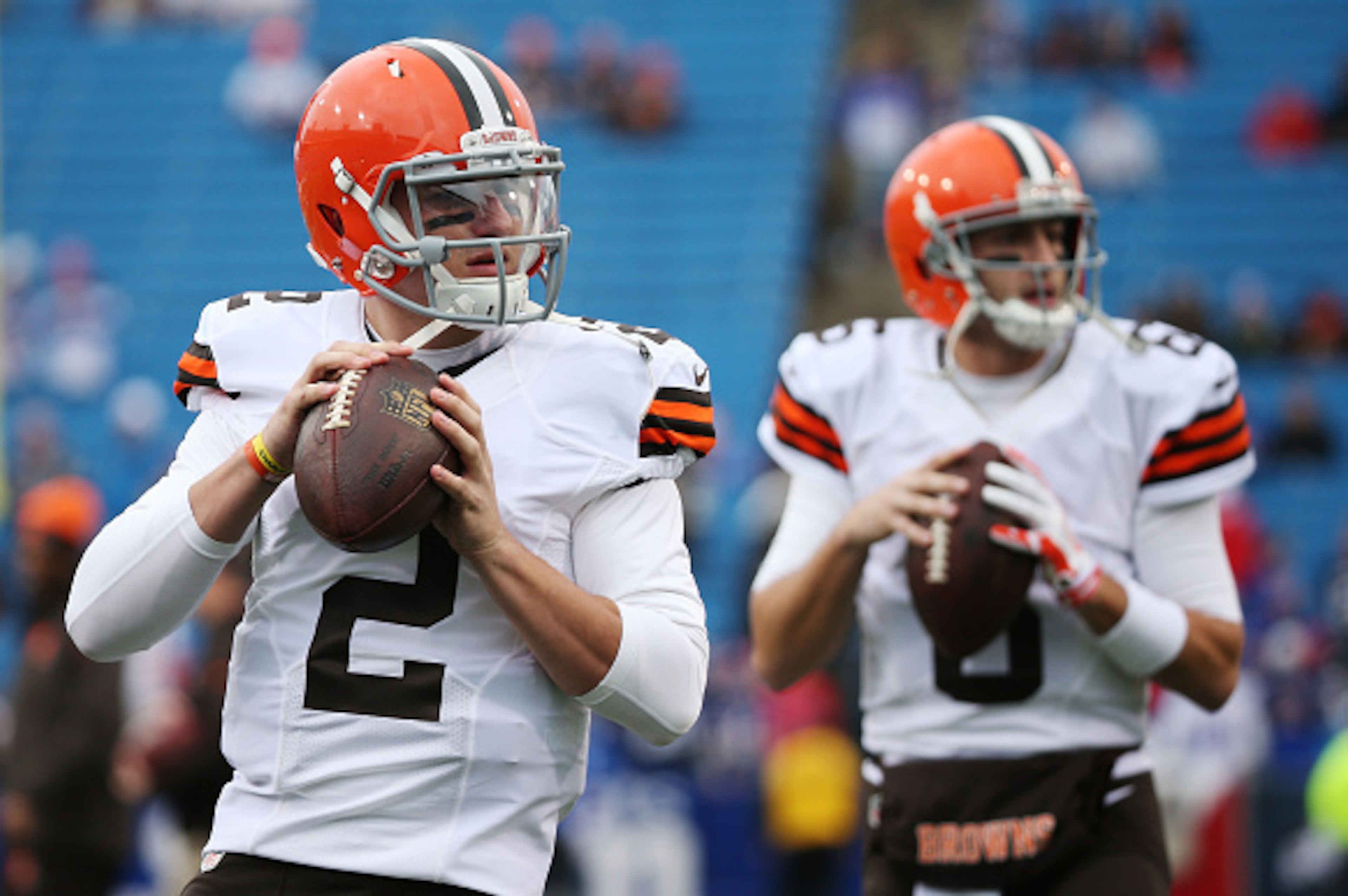 ORCHARD PARK, NY - NOVEMBER 30:   Johnny Manziel #2 of the Cleveland Browns and Brian Hoyer #6 of the Cleveland Browns warm up before the game against the Buffalo Bills at Ralph Wilson Stadium on November 30, 2014 in Orchard Park, New York.  (Photo by Bre