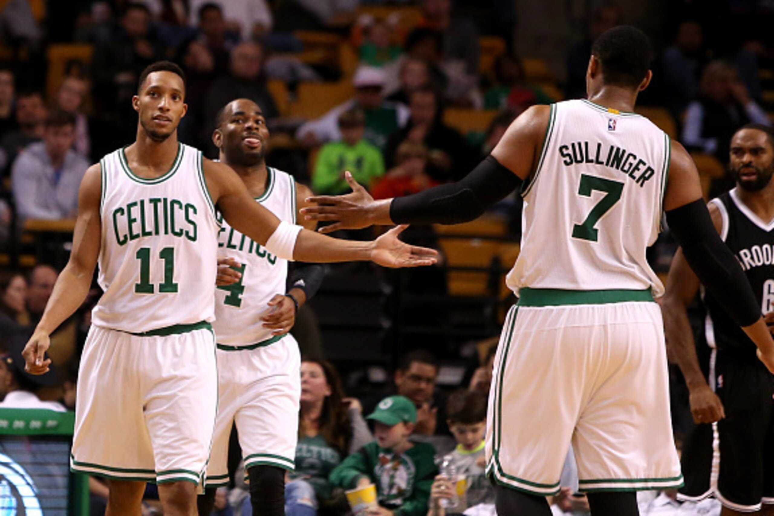 BOSTON, MA - OCTOBER 22: Evan Turner reacts with Jared Sullinger #7 of the Boston Celtics after a play in the second half against the Brooklyn Nets during a preseason game at TD Garden on October 22, 2014 in Boston, Massachusetts. NOTE TO USER: User expre