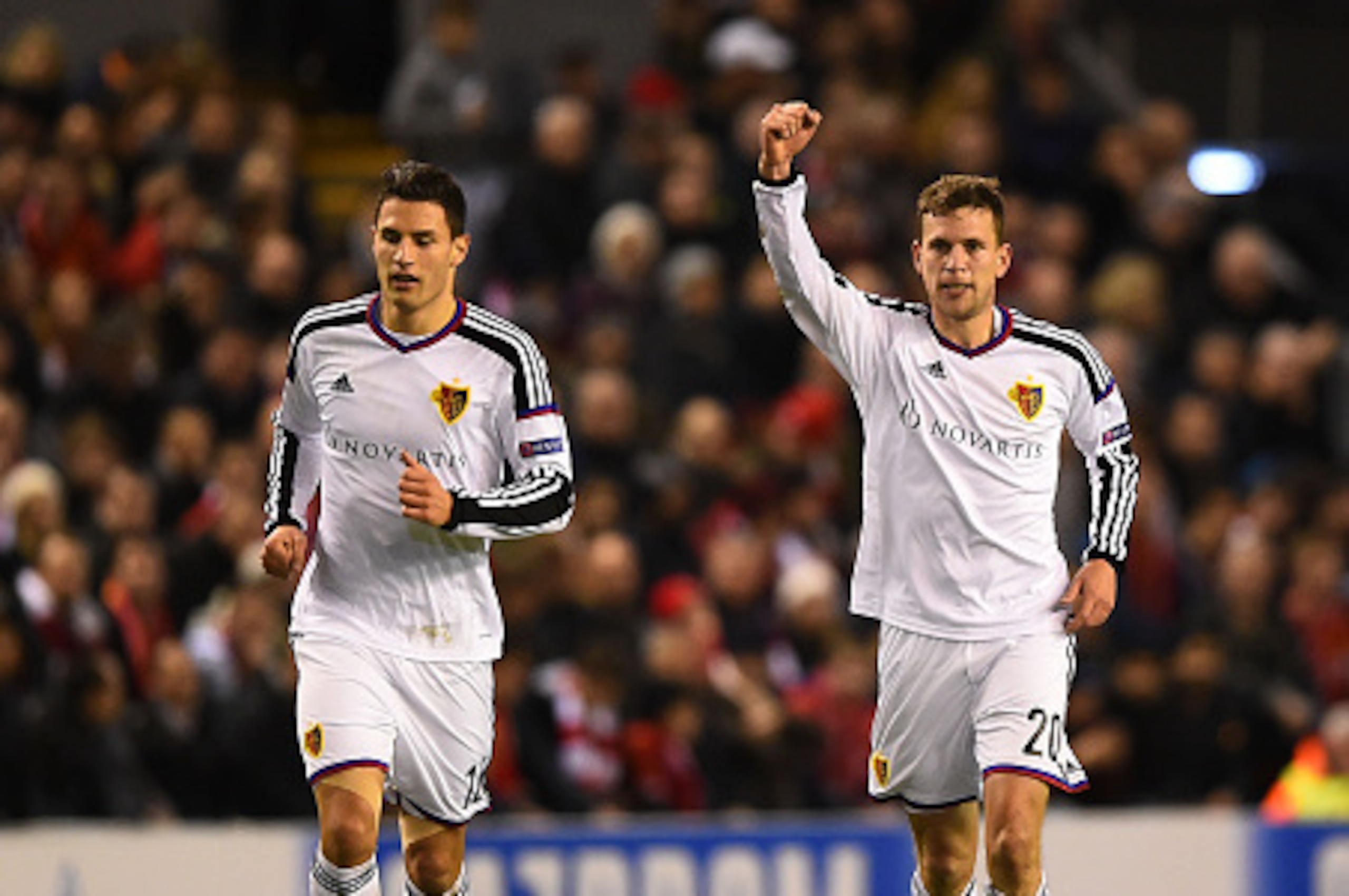 LIVERPOOL, ENGLAND - DECEMBER 09:  Fabian Frei (R) of FC Basel celebrates after scoring the opening goal during the UEFA Champions League group B match between Liverpool and FC Basel 1893 at Anfield on December 9, 2014 in Liverpool, United Kingdom.  (Phot