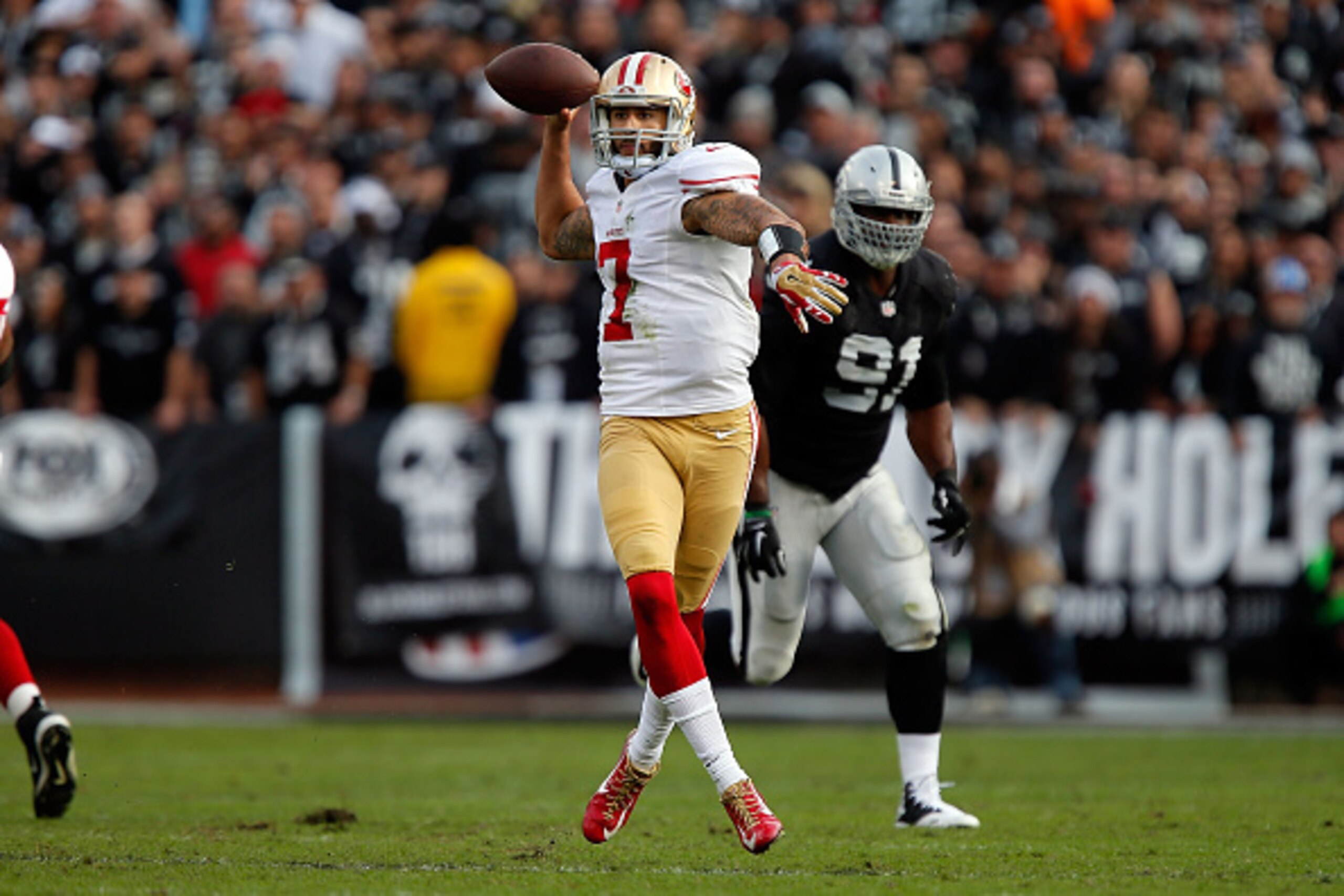 OAKLAND, CA - DECEMBER 07: Colin Kaepernick #7 of the San Francisco 49ers looks for a receiver in the second quarter against the Oakland Raiders at O.co Coliseum on December 7, 2014 in Oakland, California. (Photo by Brian Bahr/Getty Images) OAKLAND, CA - DECEMBER 07: Colin Kaepernick #7 of the San Francisco 49ers looks for a receiver in the second quarter against the Oakland Raiders at O.co Coliseum on December 7, 2014 in Oakland, California. (Photo by Brian Bahr/Getty Images)
