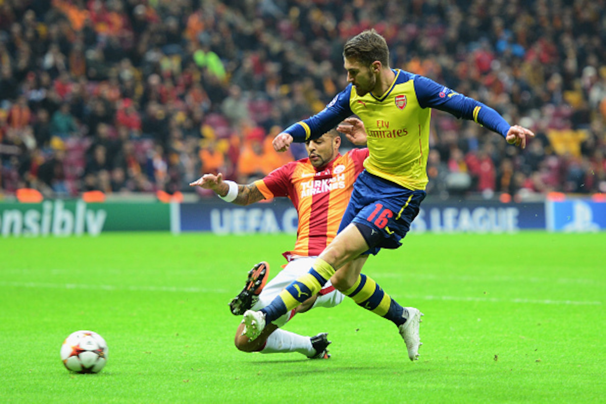 ISTANBUL, TURKEY - DECEMBER 09:  Aaron Ramsey of Arsenal (R) scores their second goal during the UEFA Champions League Group D match between Galatasaray AS and Arsenal FC at Ali Sami Yen Arena on December 9, 2014 in Istanbul, Turkey.  (Photo by Jamie McDo