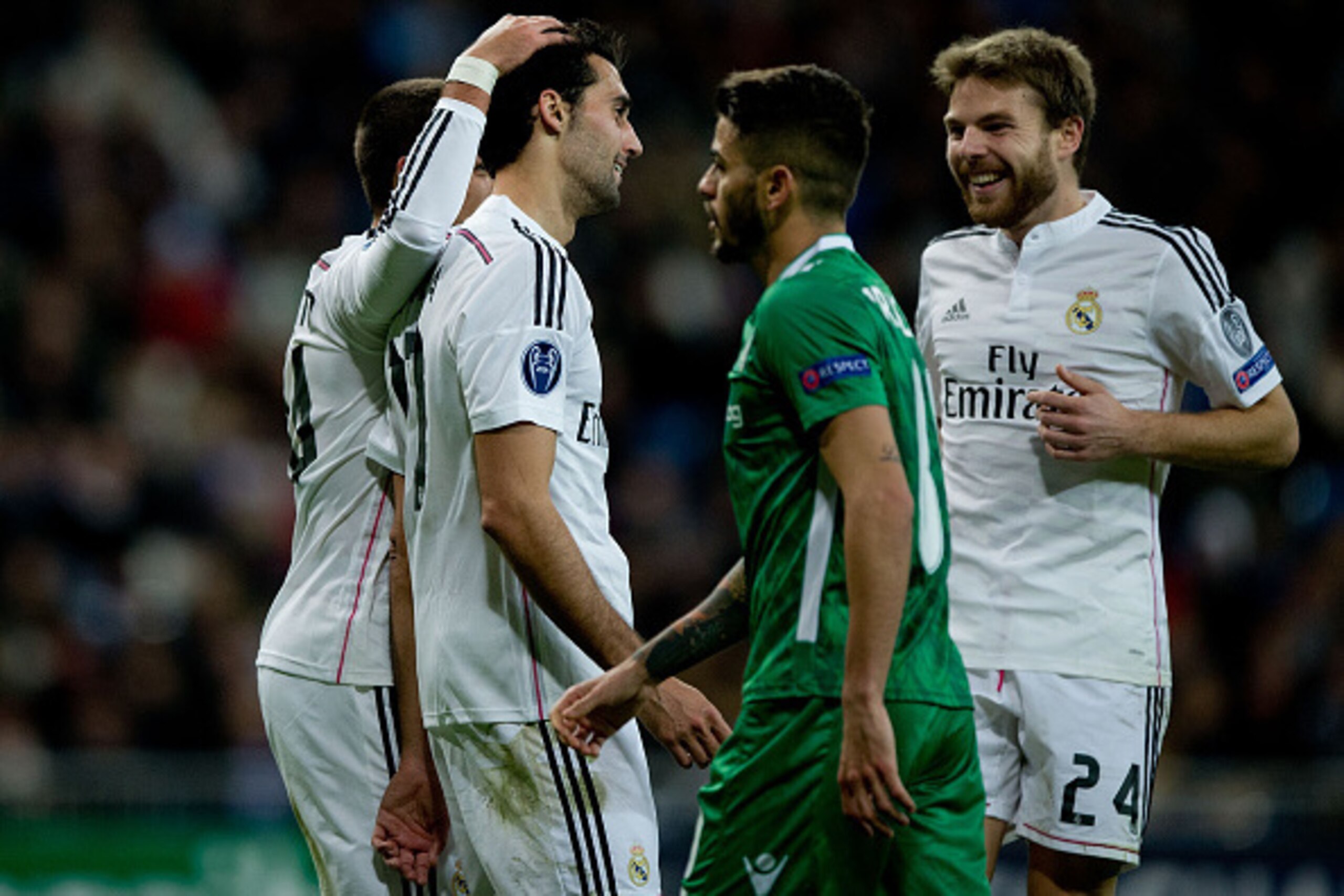 MADRID, SPAIN - DECEMBER 09: Alvaro Arbeloa (2ndL) of Real Madrid CF celebrates scoring their third goal with teammates Javier Hernandez Chicharito (L) and Asier Illarramendi (R) as Ulison de Souza Paula Junior alias Junior Caicara (2ndR) of PFC Ludogoret MADRID, SPAIN - DECEMBER 09: Alvaro Arbeloa (2ndL) of Real Madrid CF celebrates scoring their third goal with teammates Javier Hernandez Chicharito (L) and Asier Illarramendi (R) as Ulison de Souza Paula Junior alias Junior Caicara (2ndR) of PFC Ludogoret