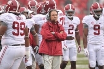 Oct 11, 2014; Fayetteville, AR, USA; Alabama Crimson Tide head coach Nick Saban watches a replay during the first quarter against the Arkansas Razorbacks at Donald W. Reynolds Razorback Stadium. Mandatory Credit: Nelson Chenault-USA TODAY Sports
